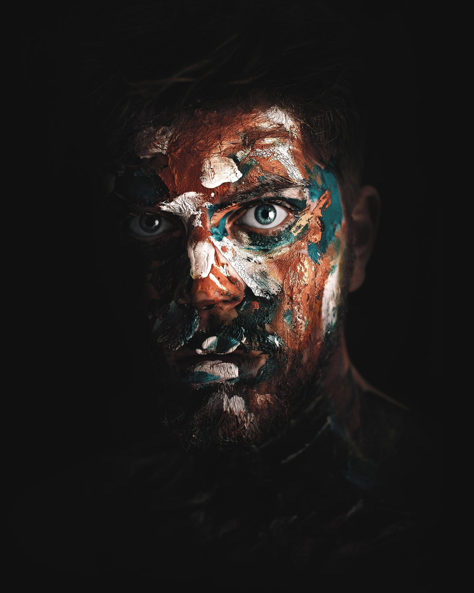 Man's Face Covered In Paint Background