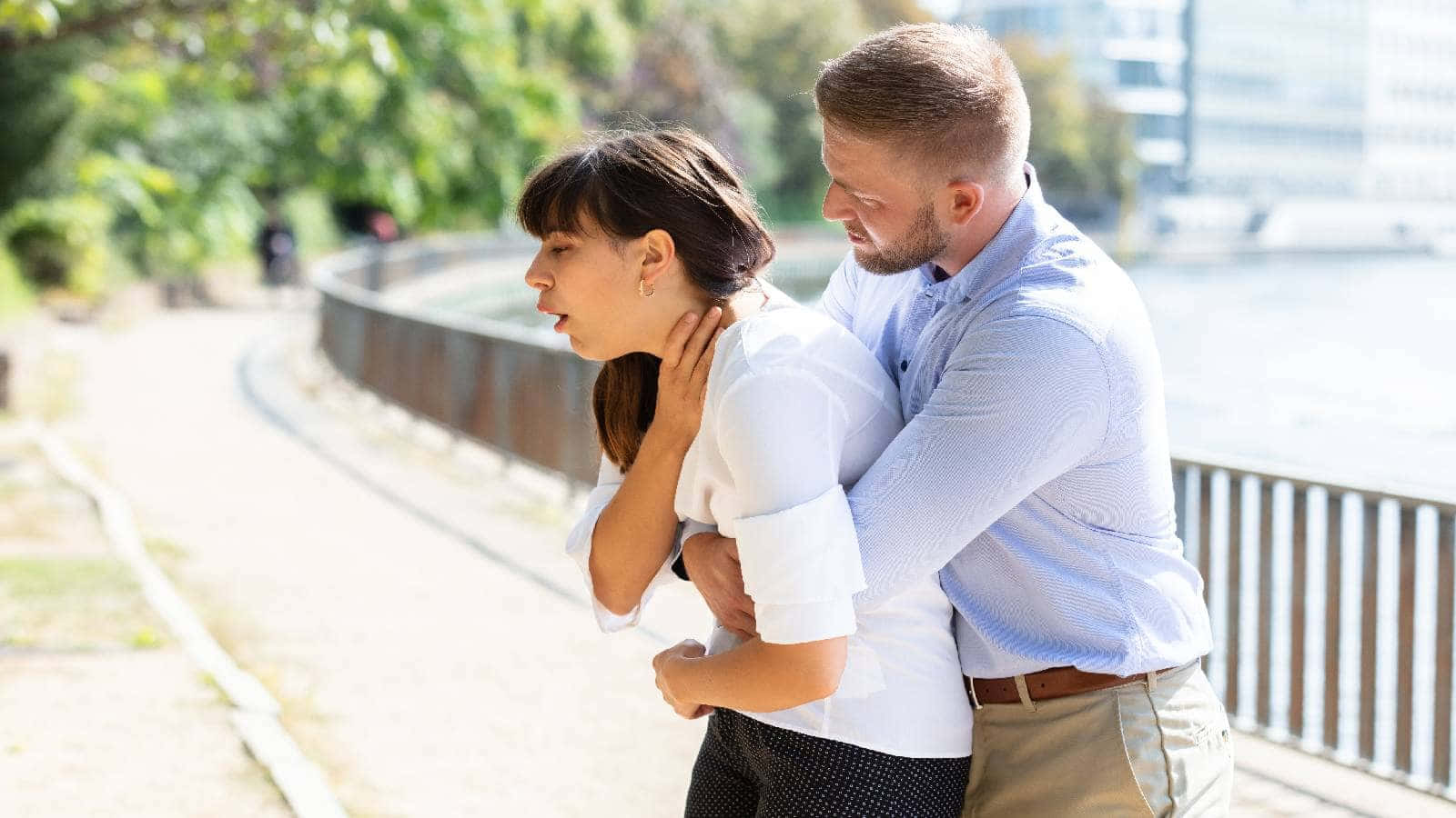 Man Saving A Choking Woman Background