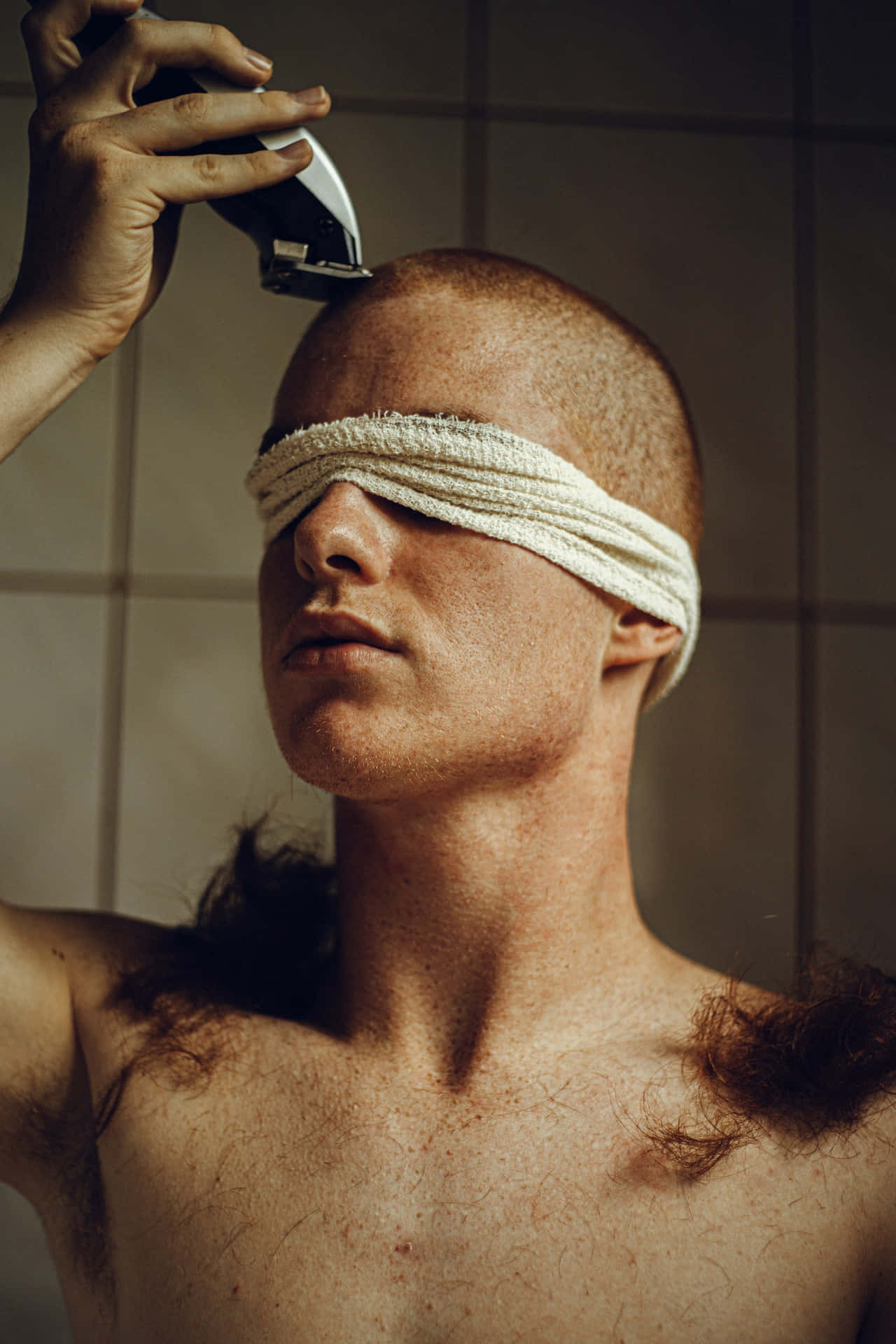 Man Shaving Headwith Electric Trimmer