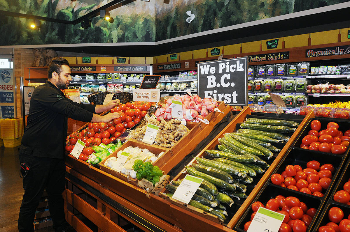 Man Shopping At Thrifty Foods Supermarket Background