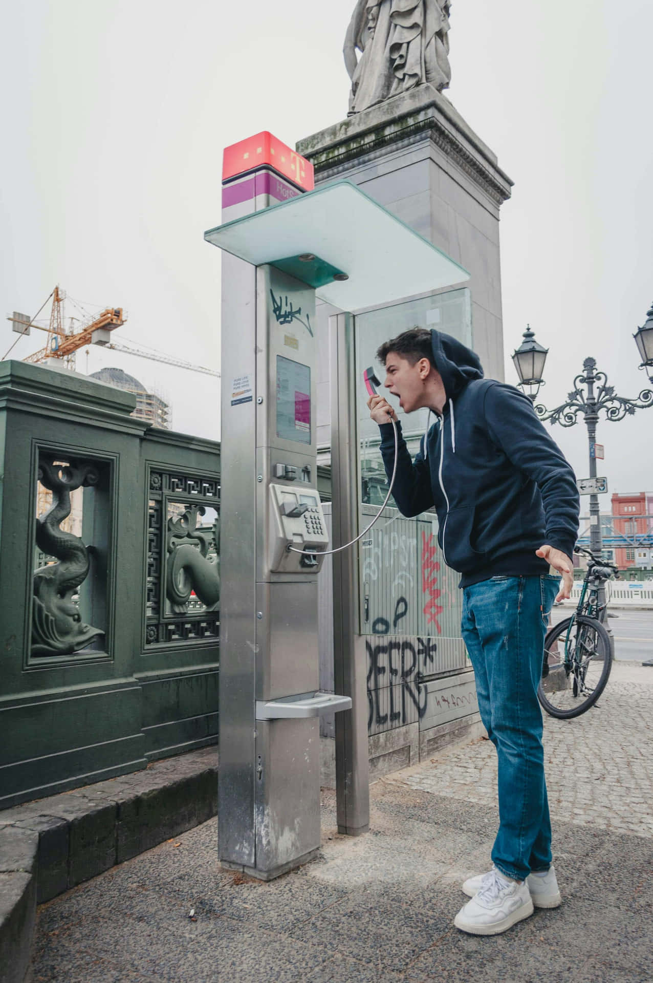 Man Shouting Into Payphone