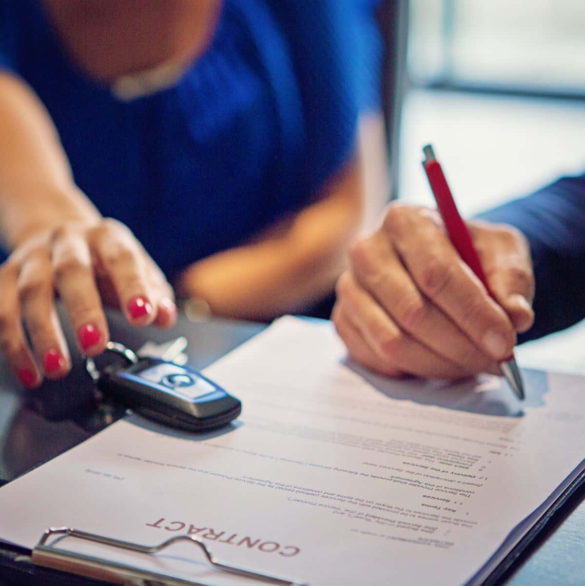 Man Signing A Car Purchase Agreement Background