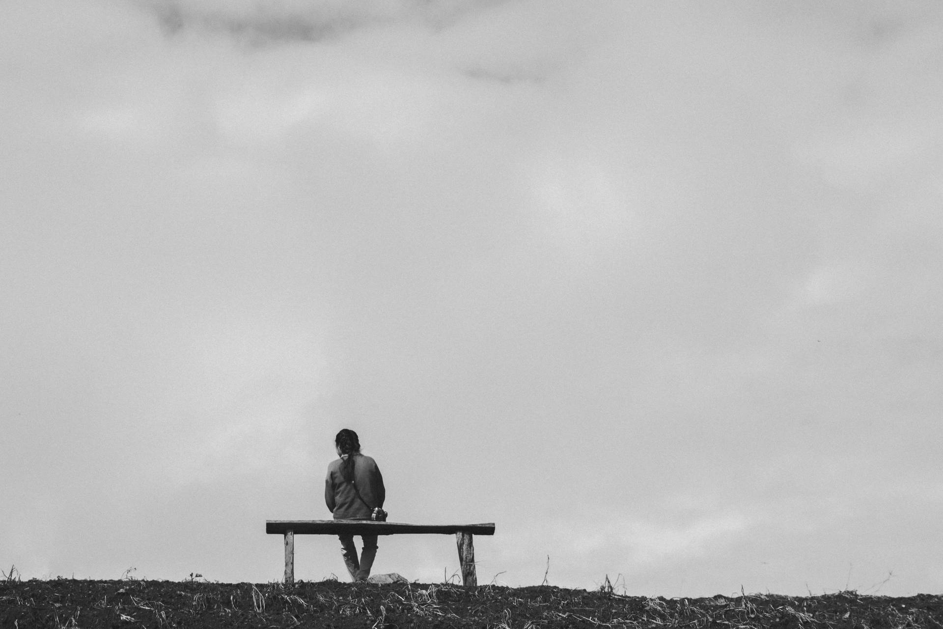 Man Sitting On Bench Background