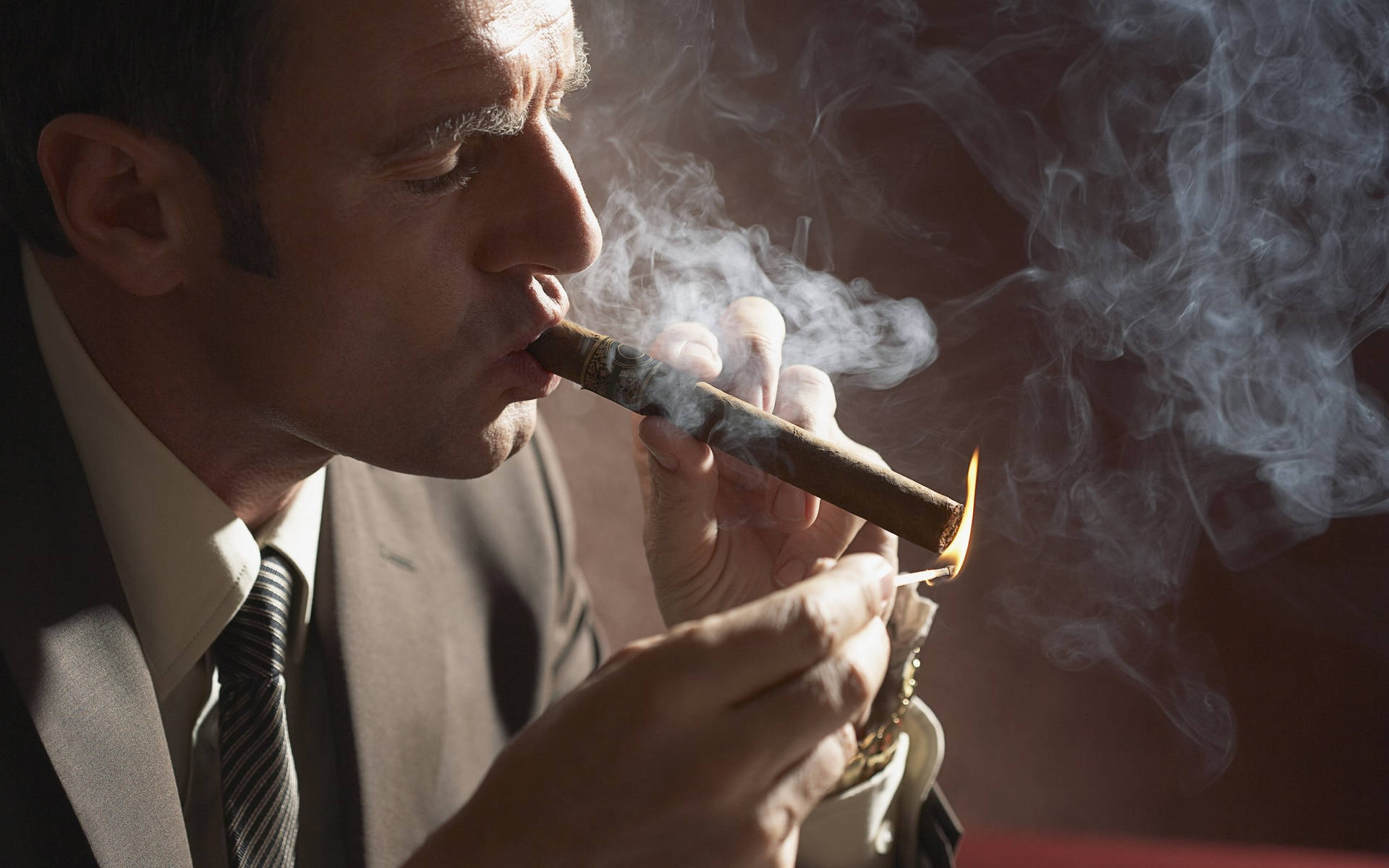 Man Smoking Cigarette With Tuxedo Background