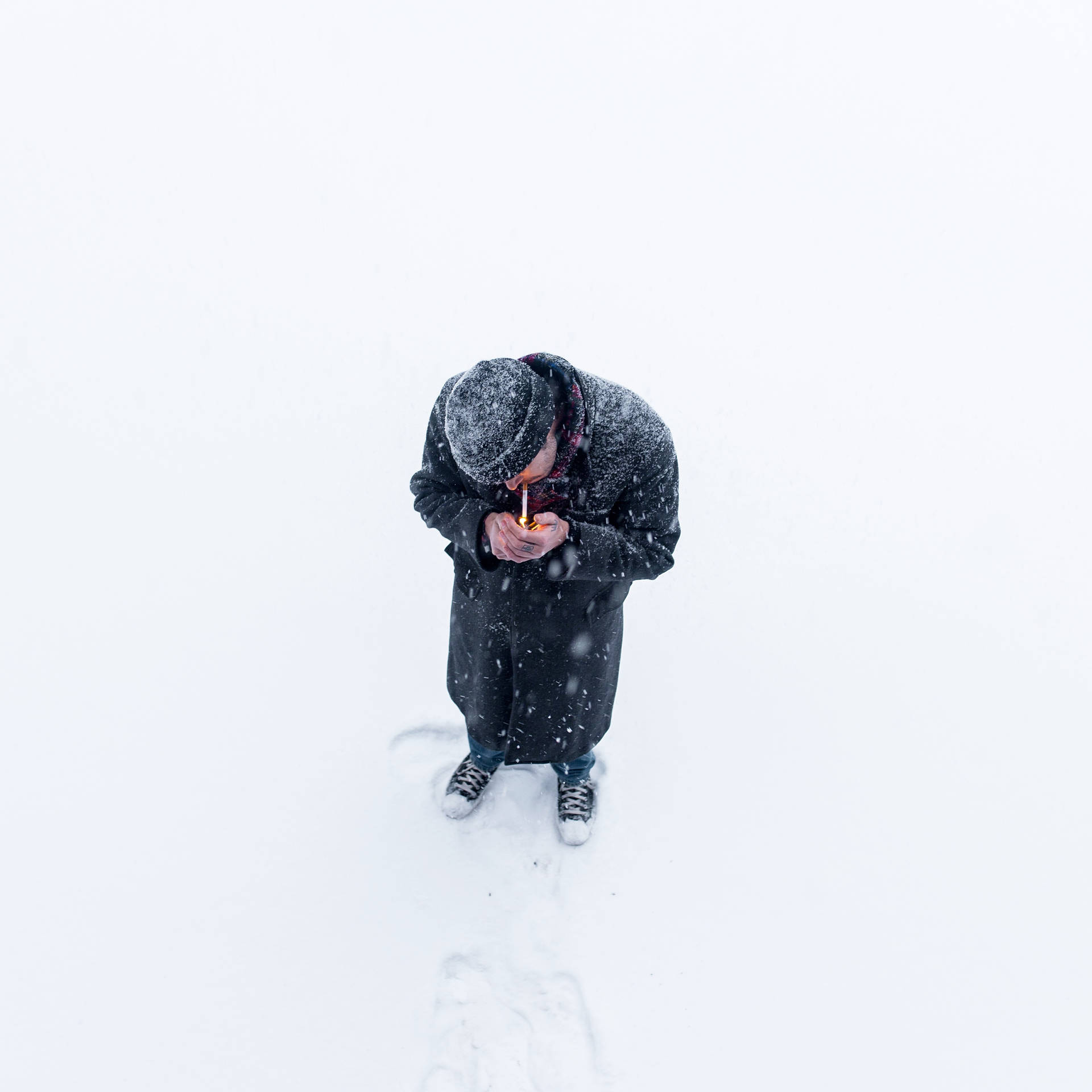Man Smoking In Snow Background