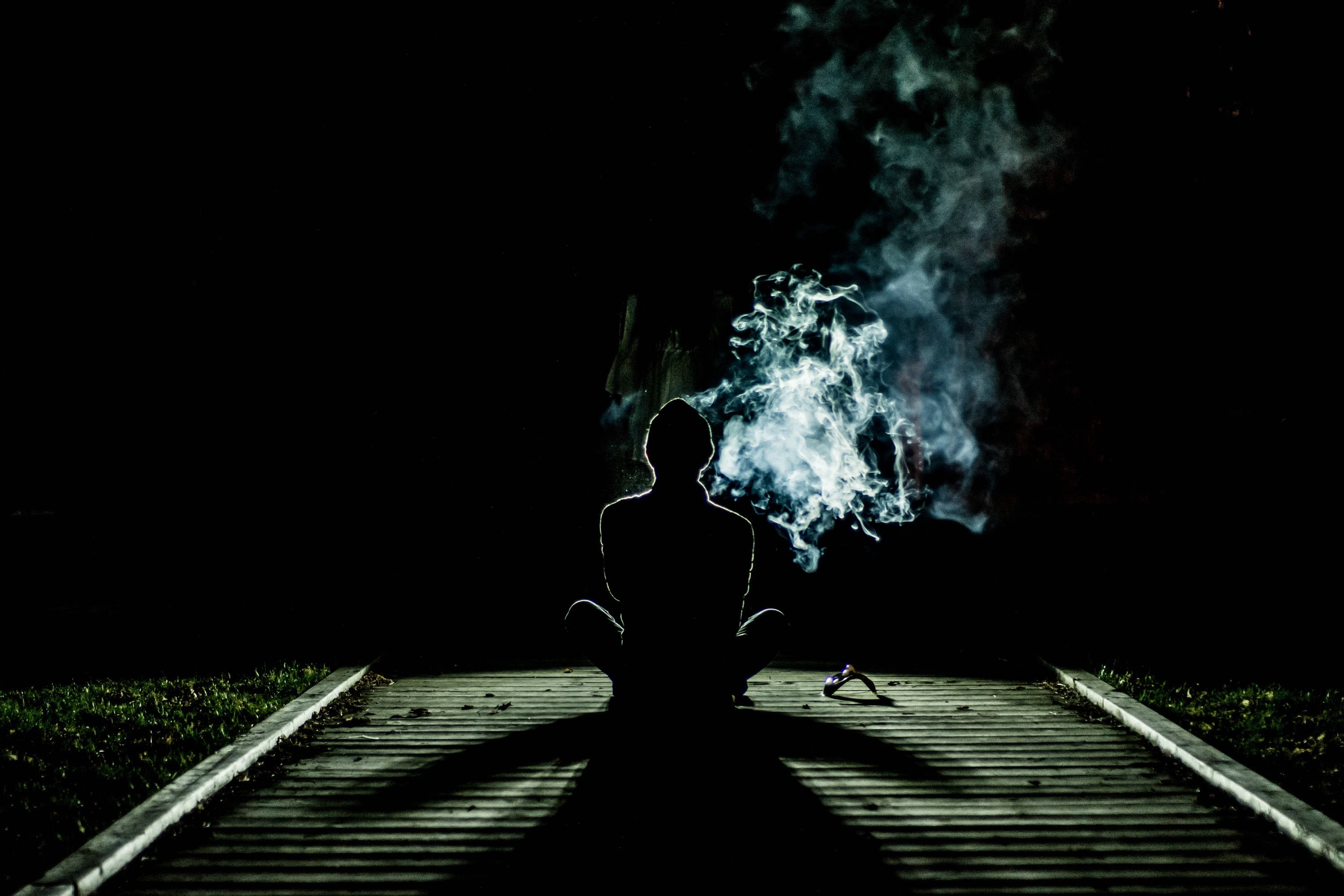 Man Smoking On Pathway Alone Phone Background