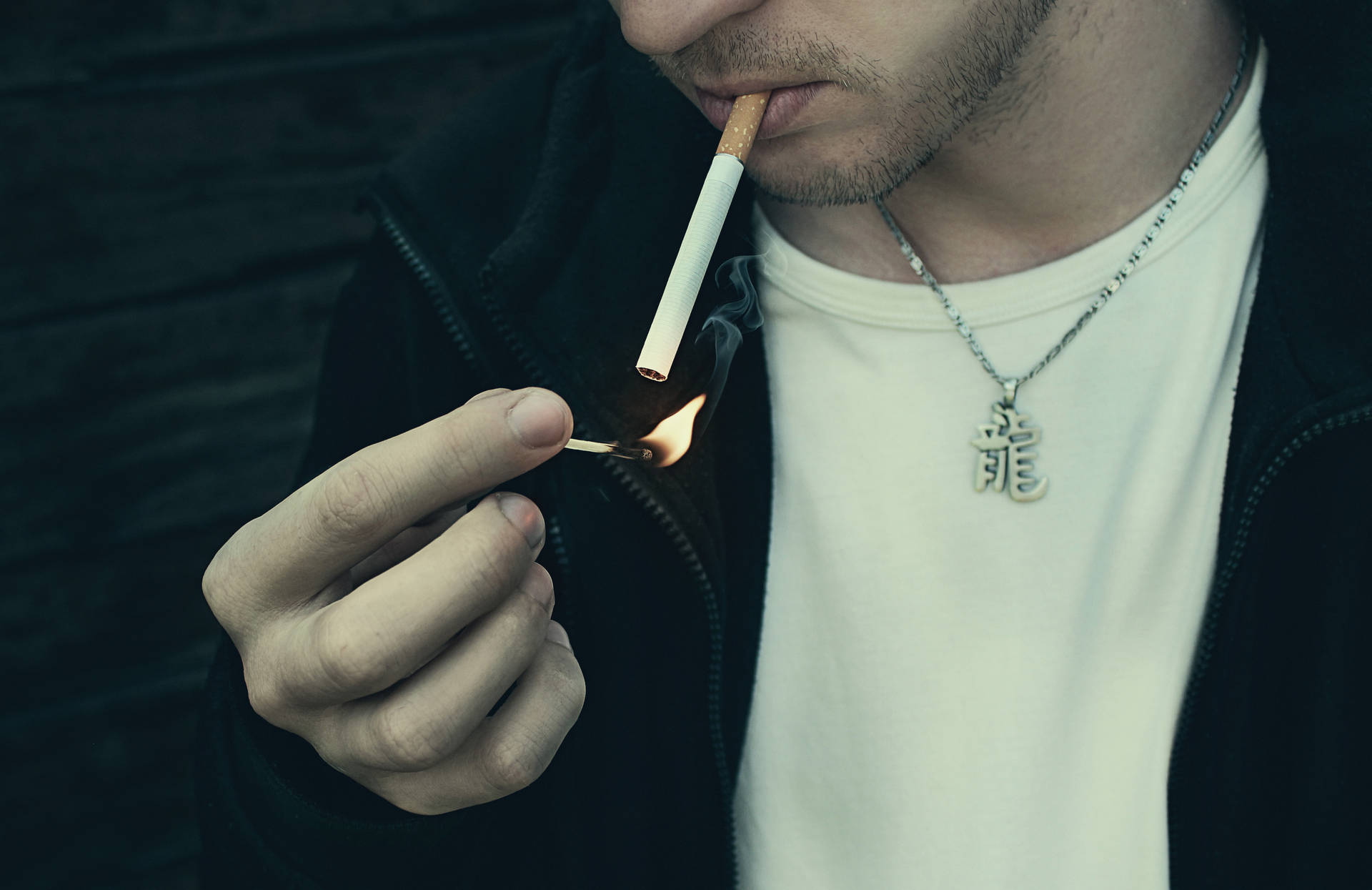 Man Smoking With Match Stick Background