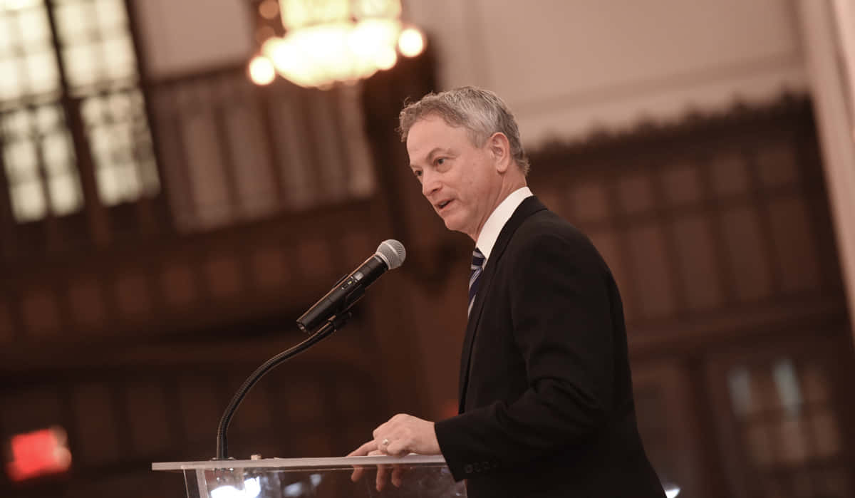 Man Speakingat Podium Background