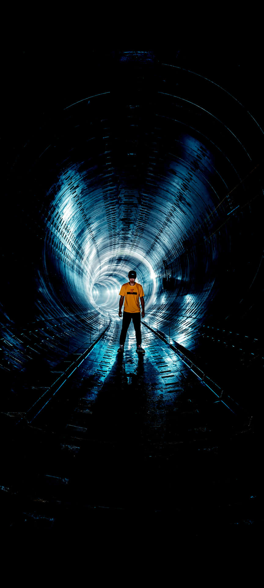 Man Standingin Illuminated Tunnel