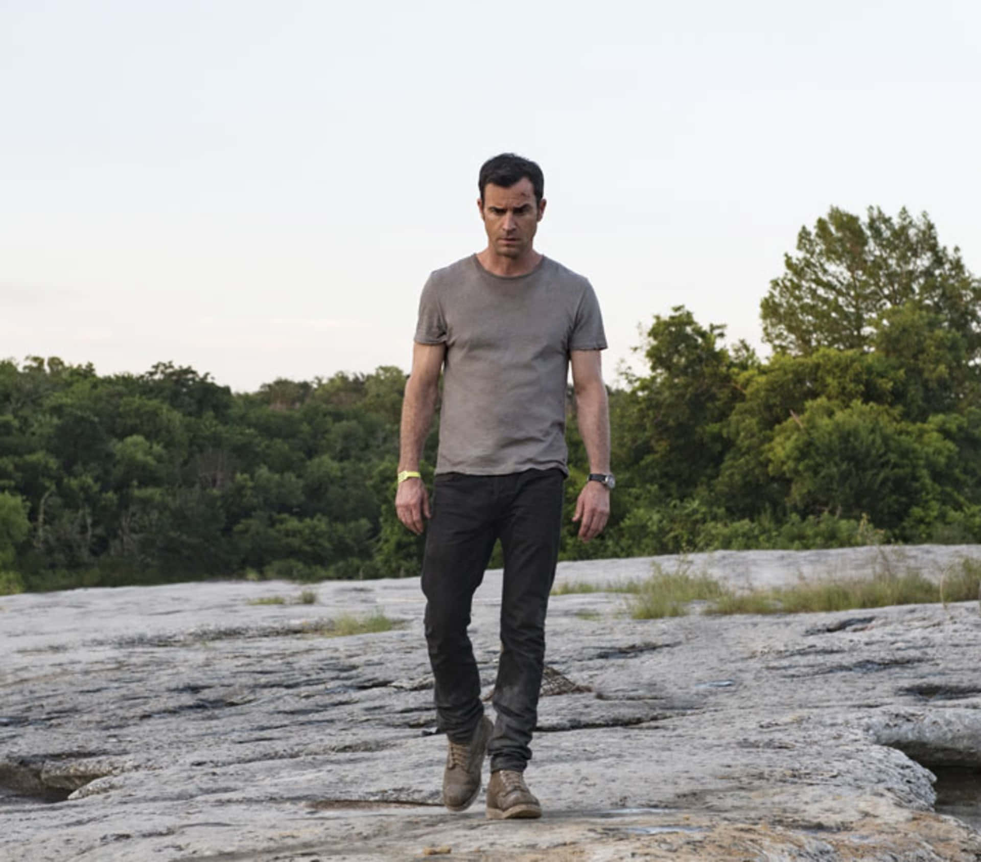 Man Standingon Rocky Terrain