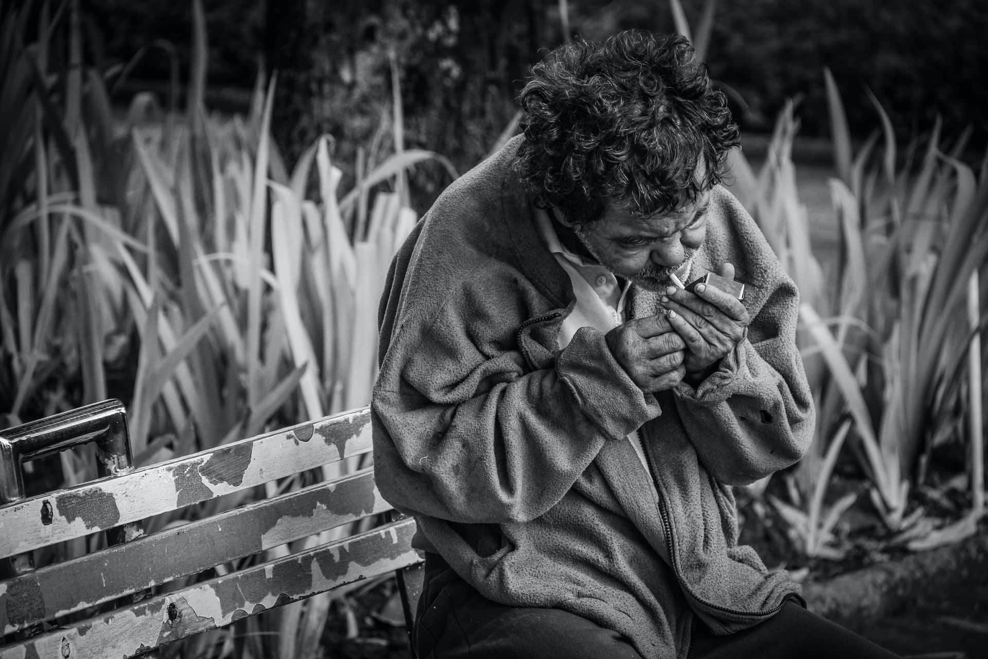 Man Struggling With Smoking Addiction In Monochrome Background