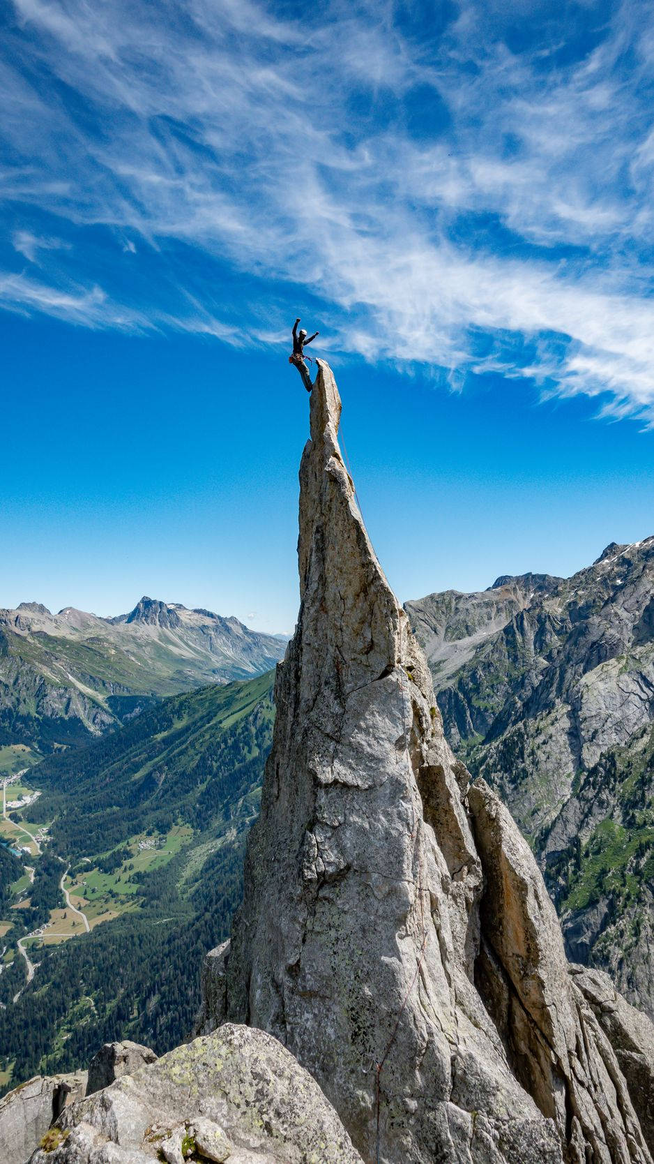 Man Succeeds In Climbing A Rock Structure Background