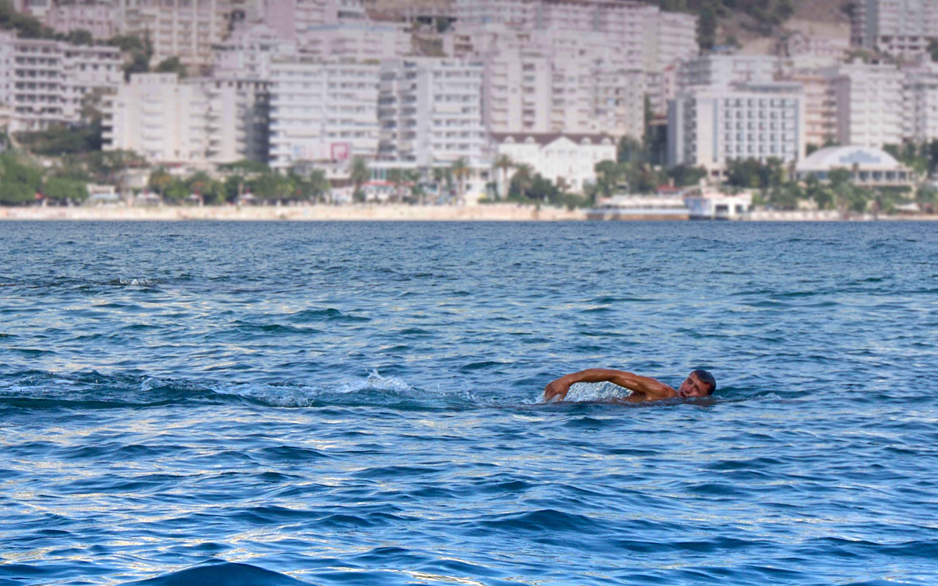 Man Swimming In Ocean