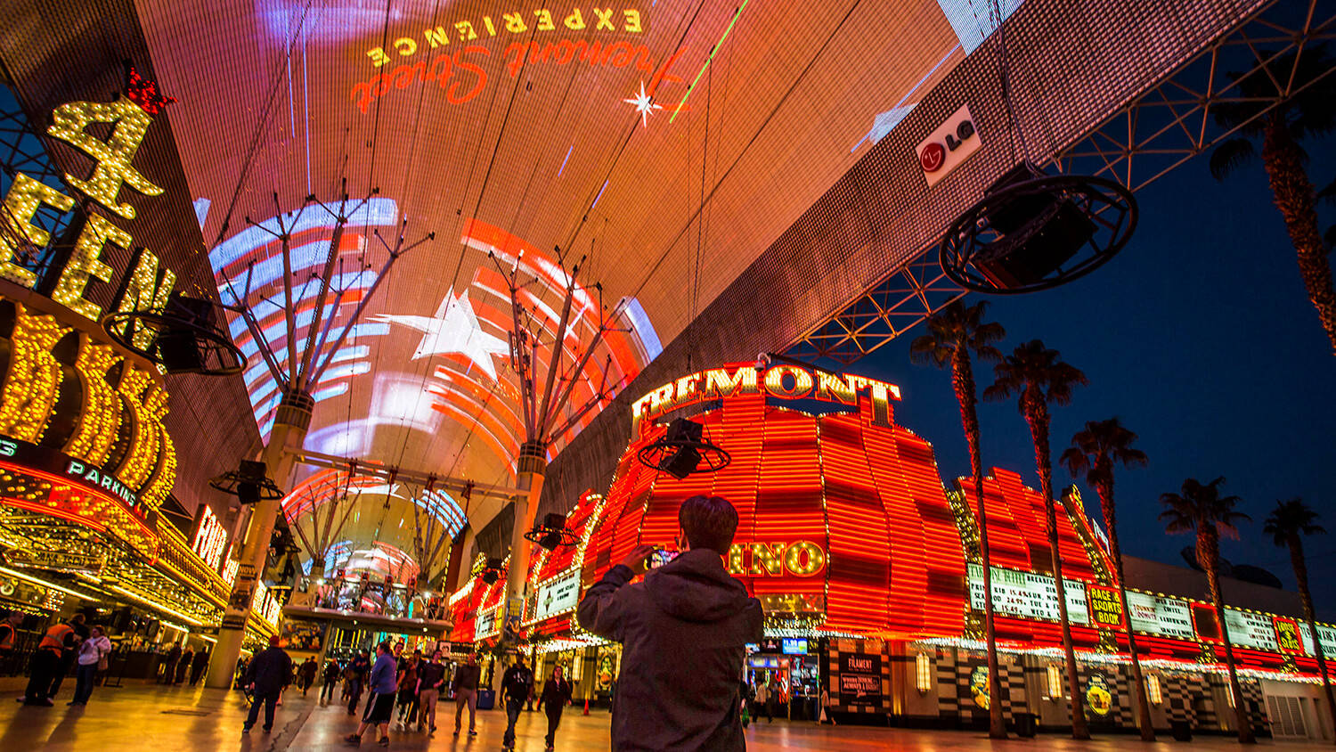 Man Taking Pictures Fremont Street