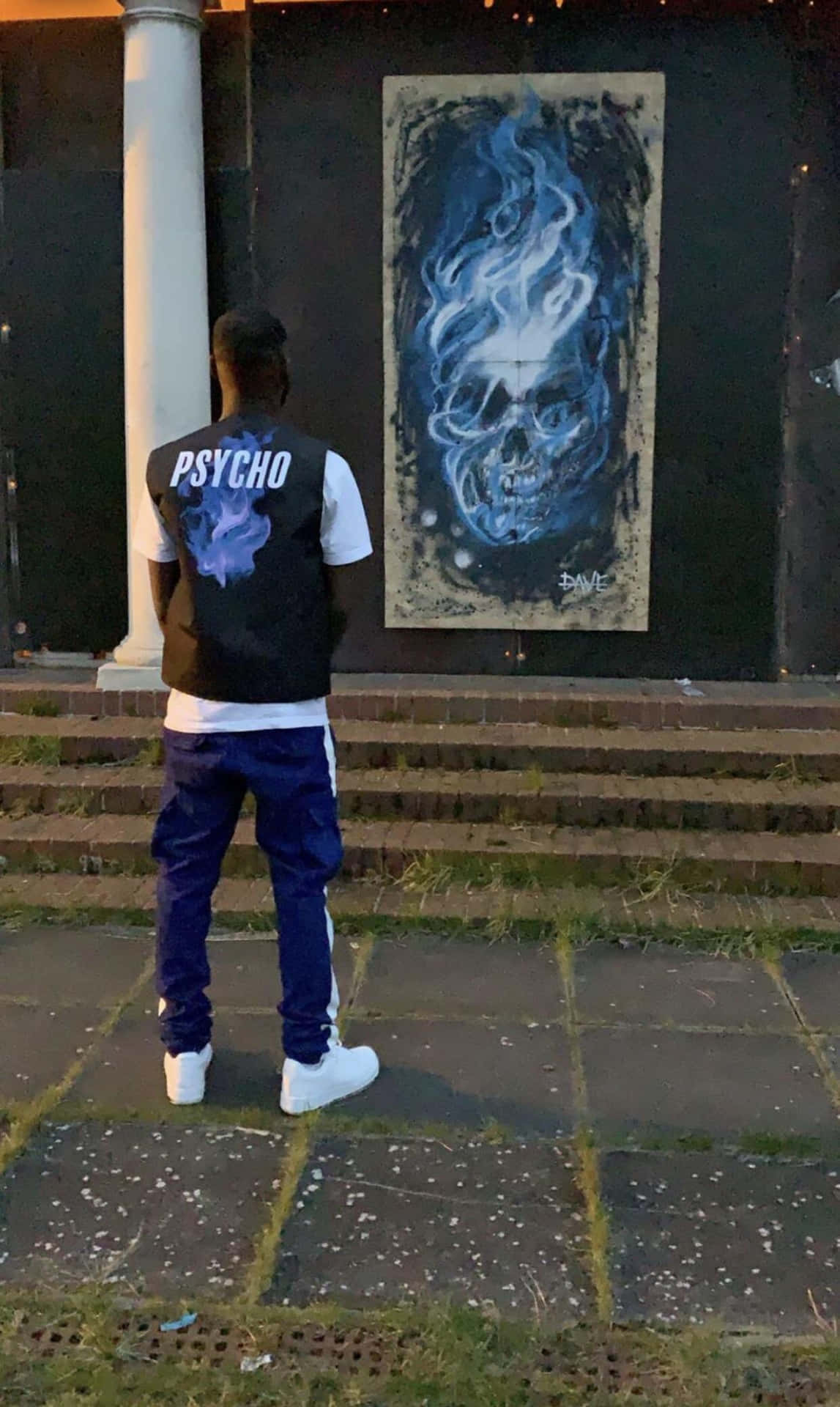 Man Viewing Skull Graffiti Art Background