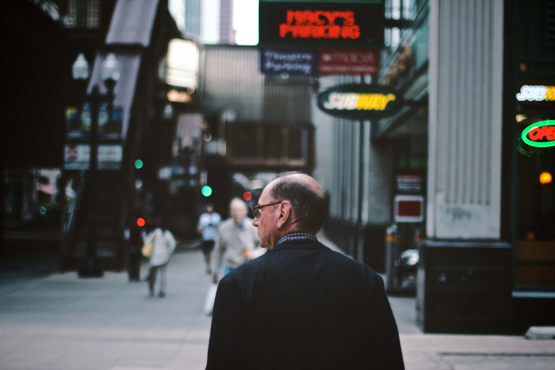 Man Walking Towards Random People Background