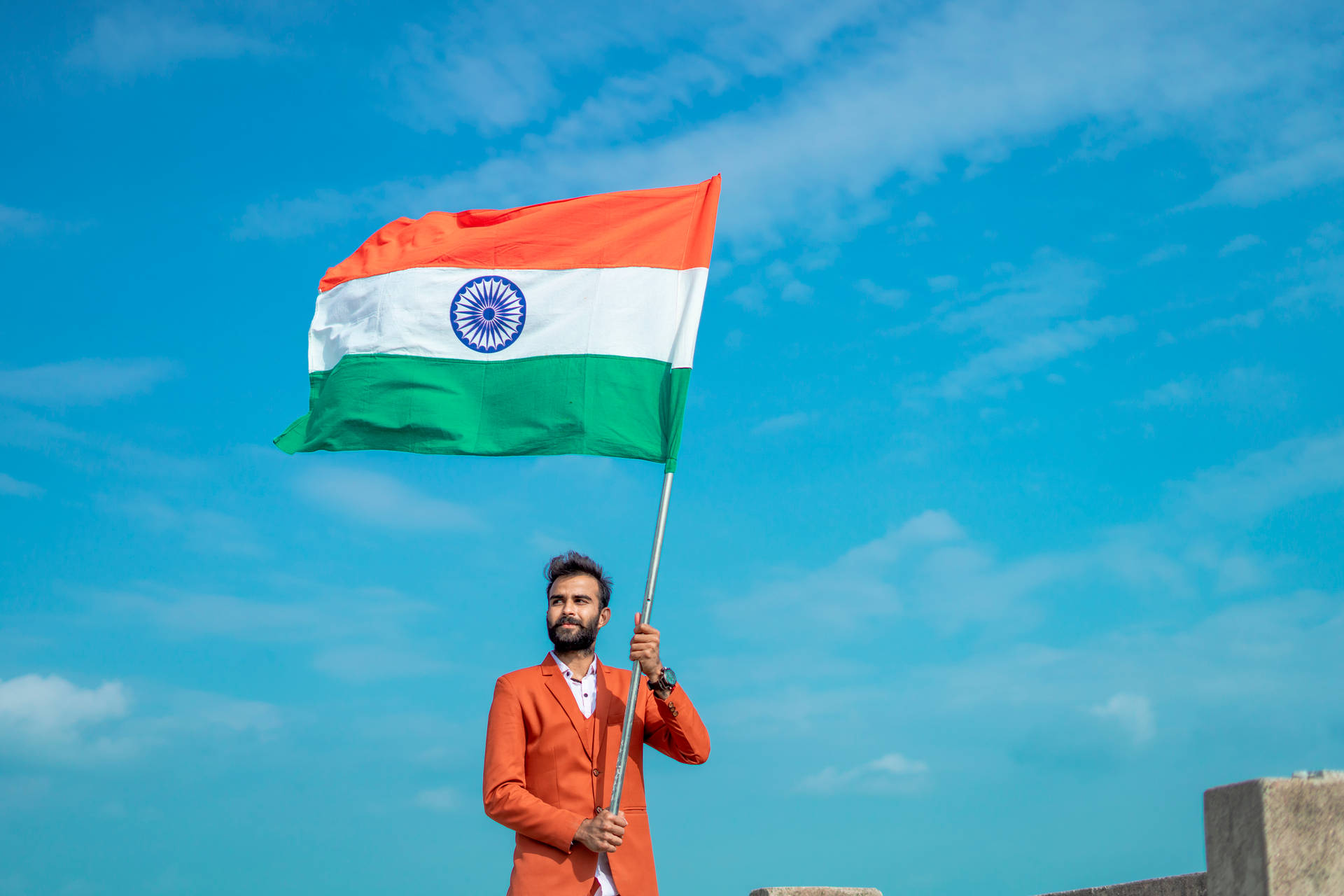 Man Waving Tiranga Indian Flag Background