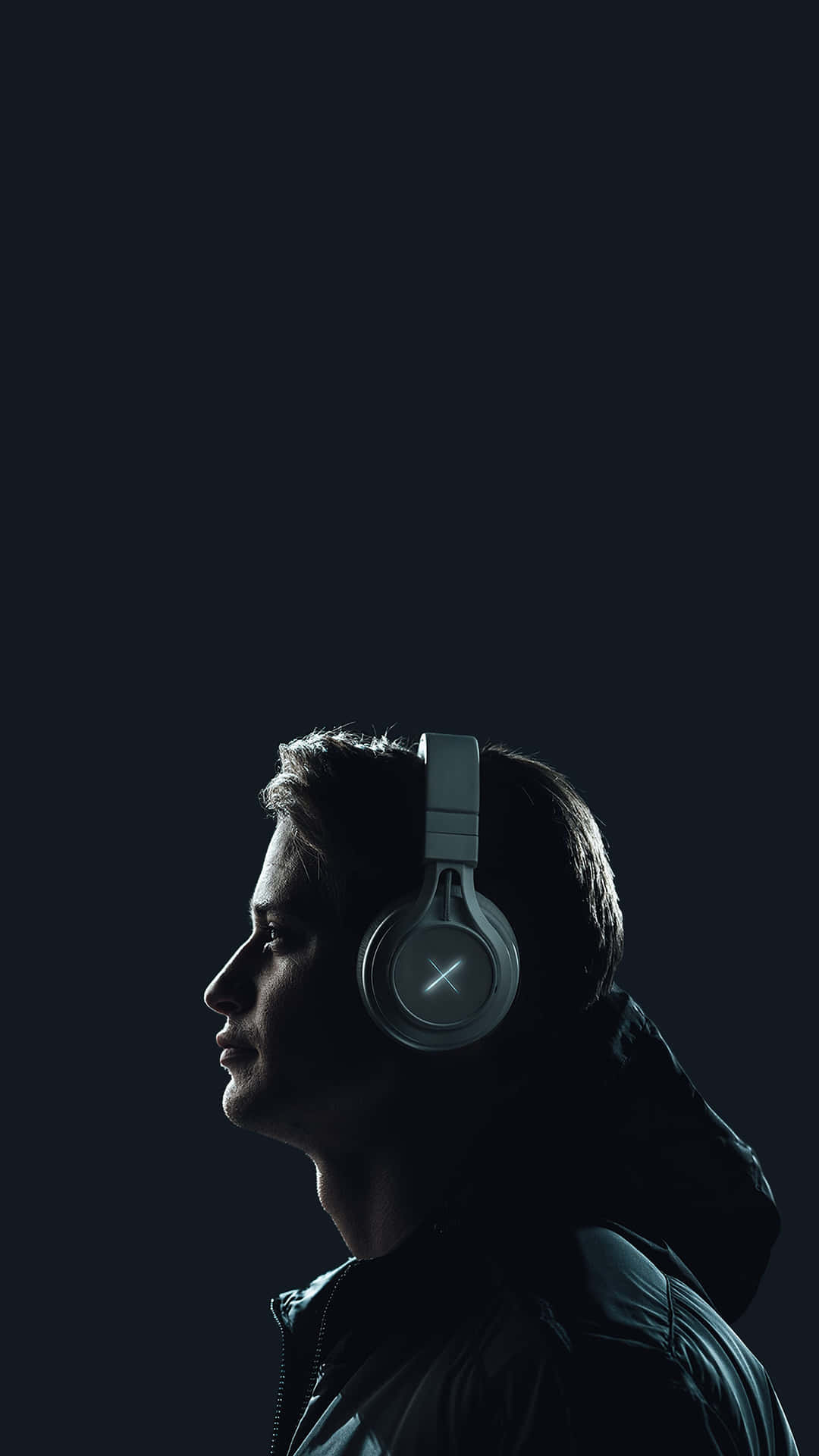 Man Wearing A Wireless Peripheral Headphones Background