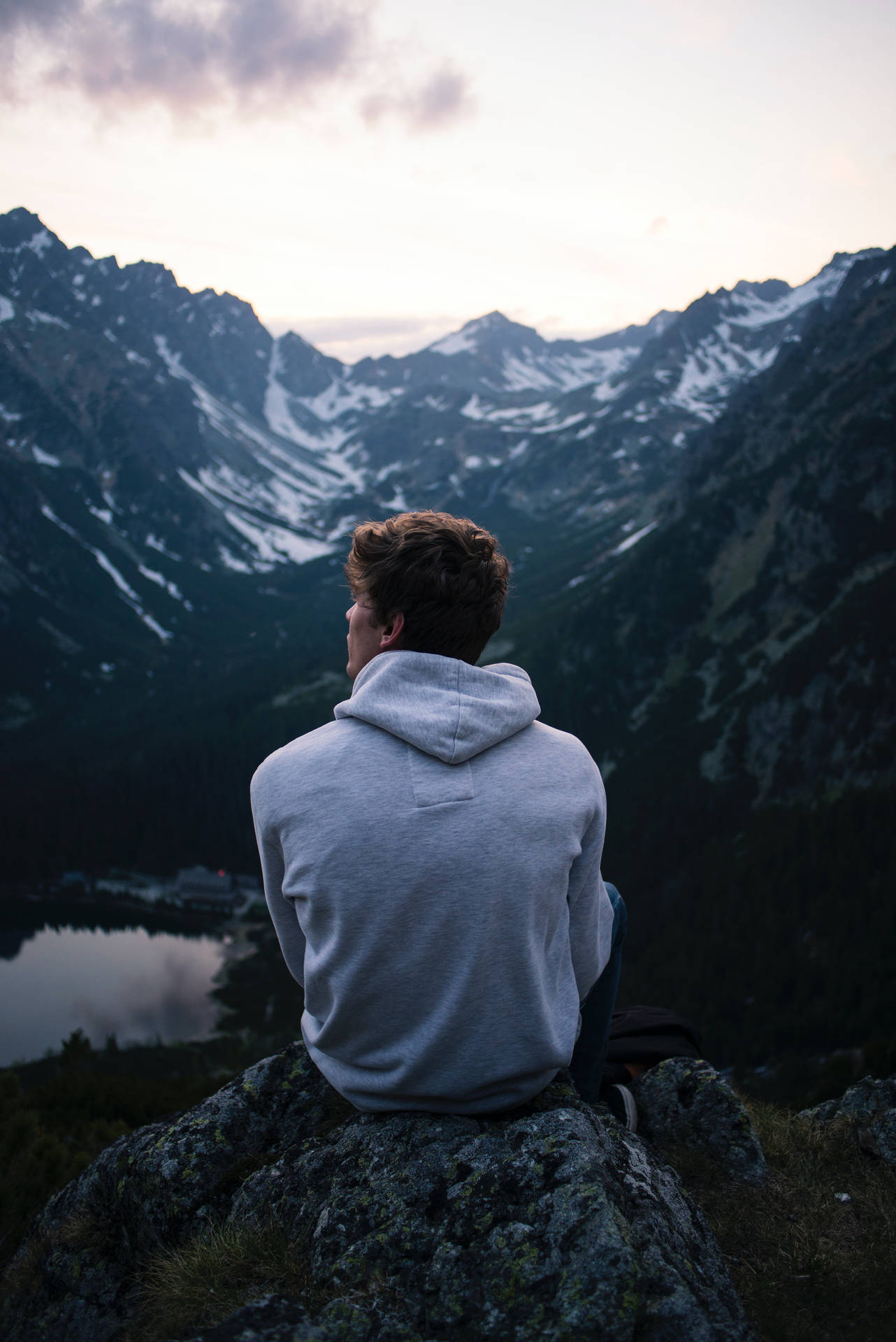 Man Wearing Hoodie Sitting Alone Background