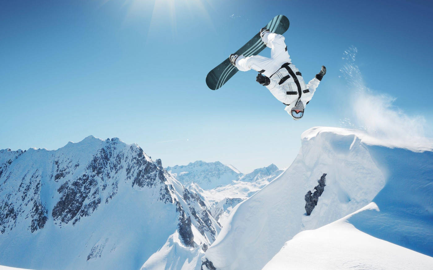 Man With A Snowboard Doing A Backflip Background