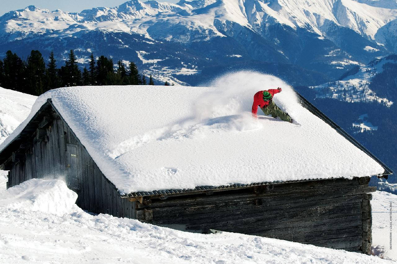 Man With Snowboard Dashing On Roof