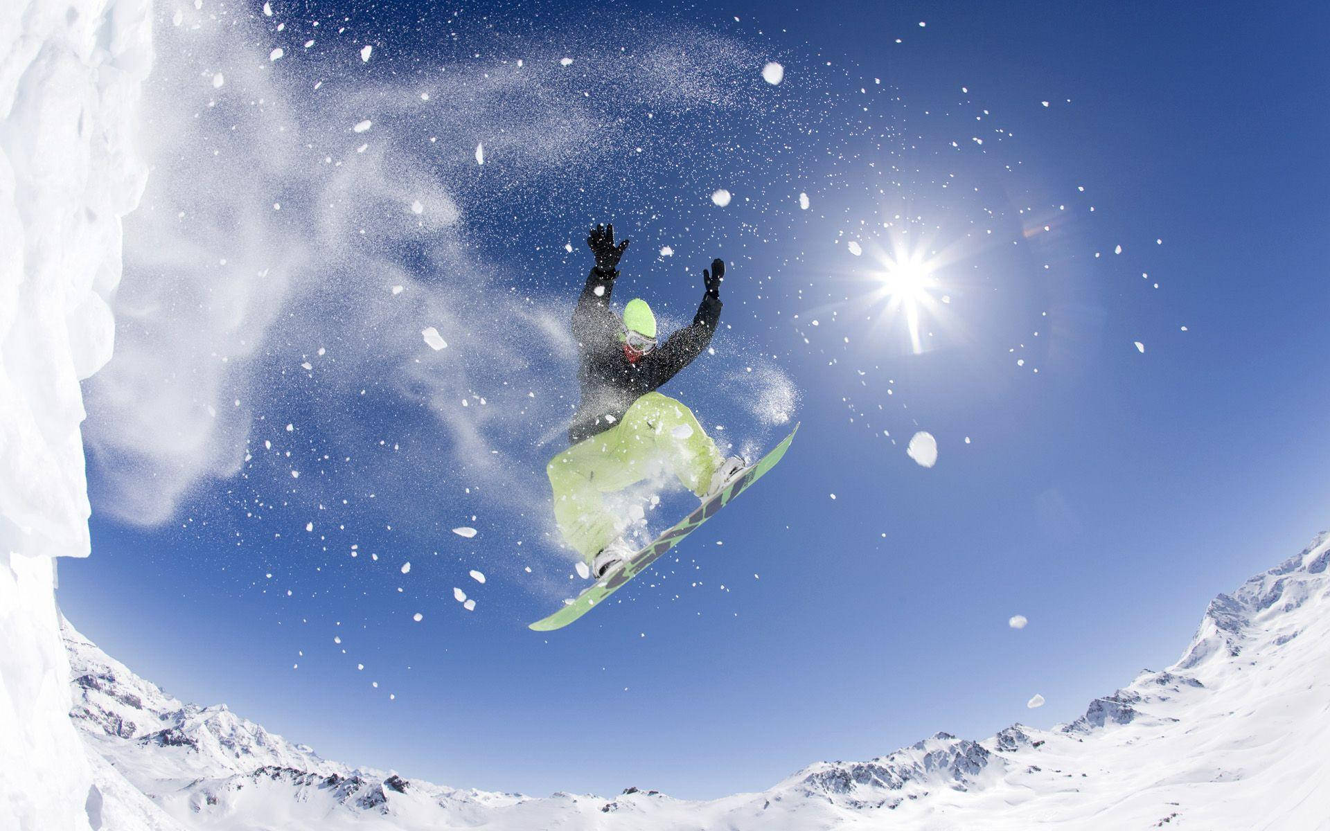 Man With Snowboard Posing Mid-trick