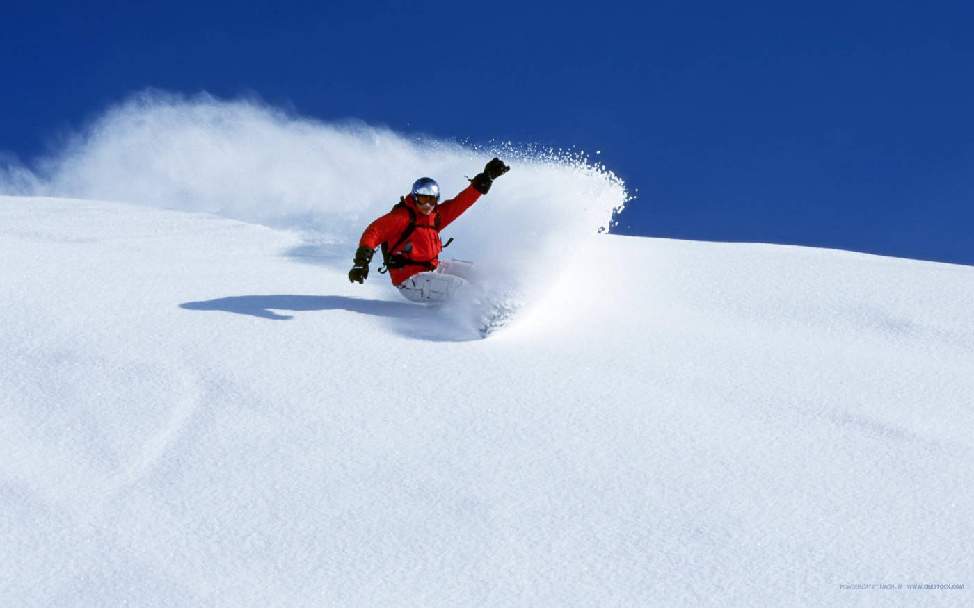 Man With Snowboard With One Arm Raised