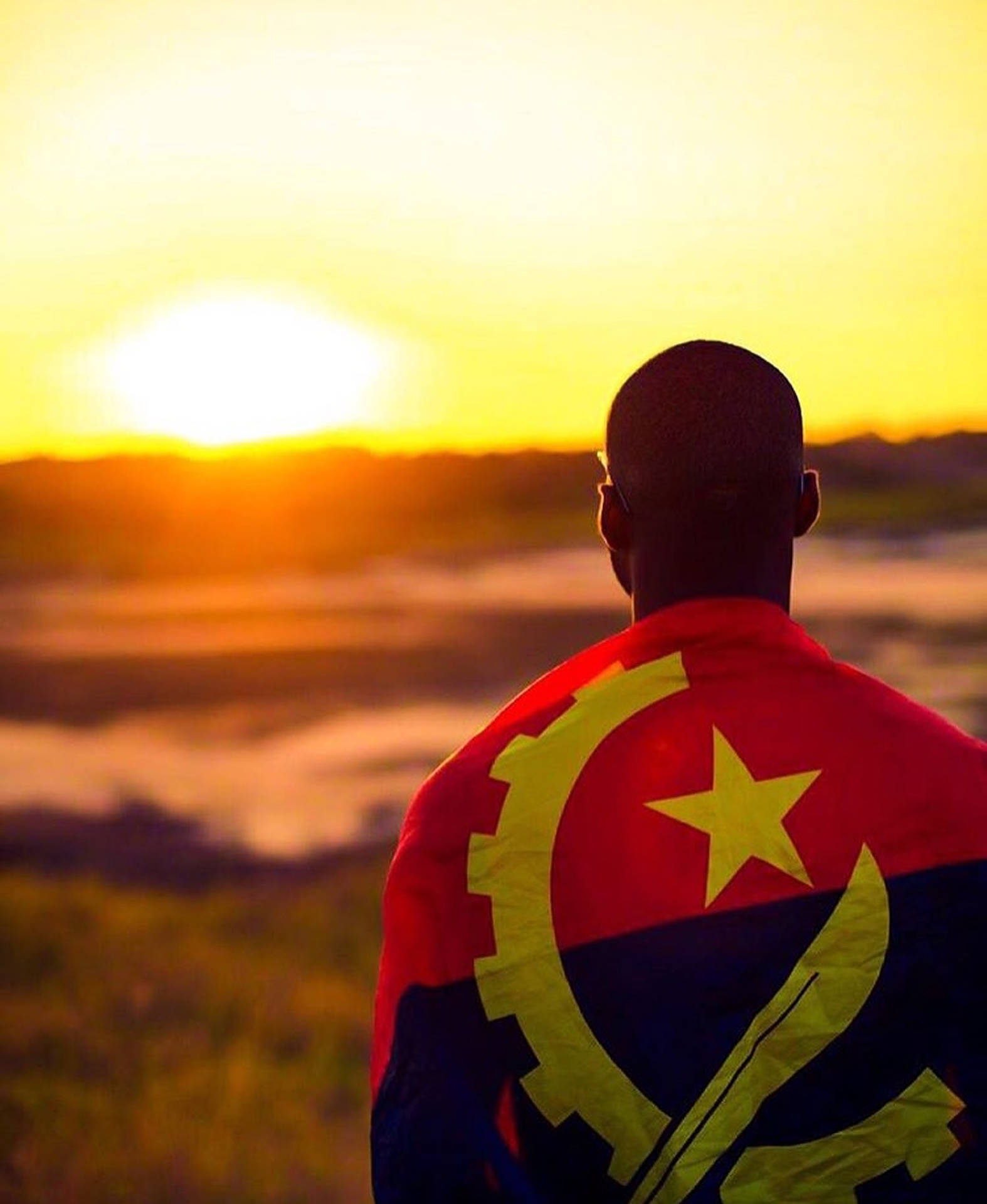 Man With The Flag Of Angola Background