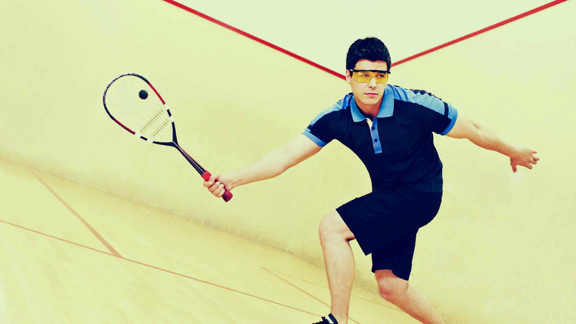 Man With Yellow Goggles Playing Squash