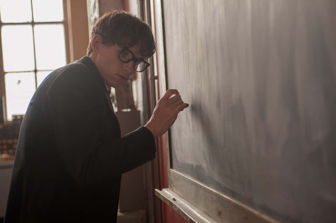 Man Writingon Blackboard