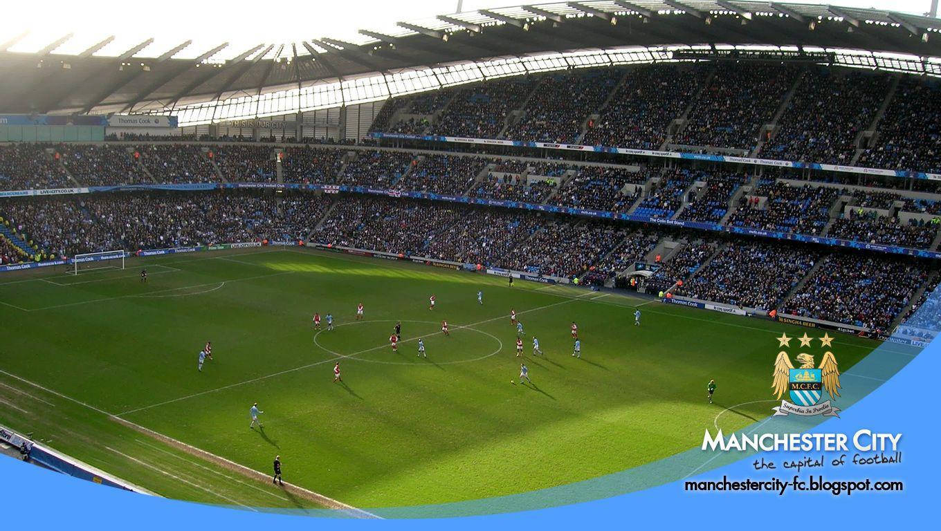 Manchester City Fc Logo Over Etihad Stadium