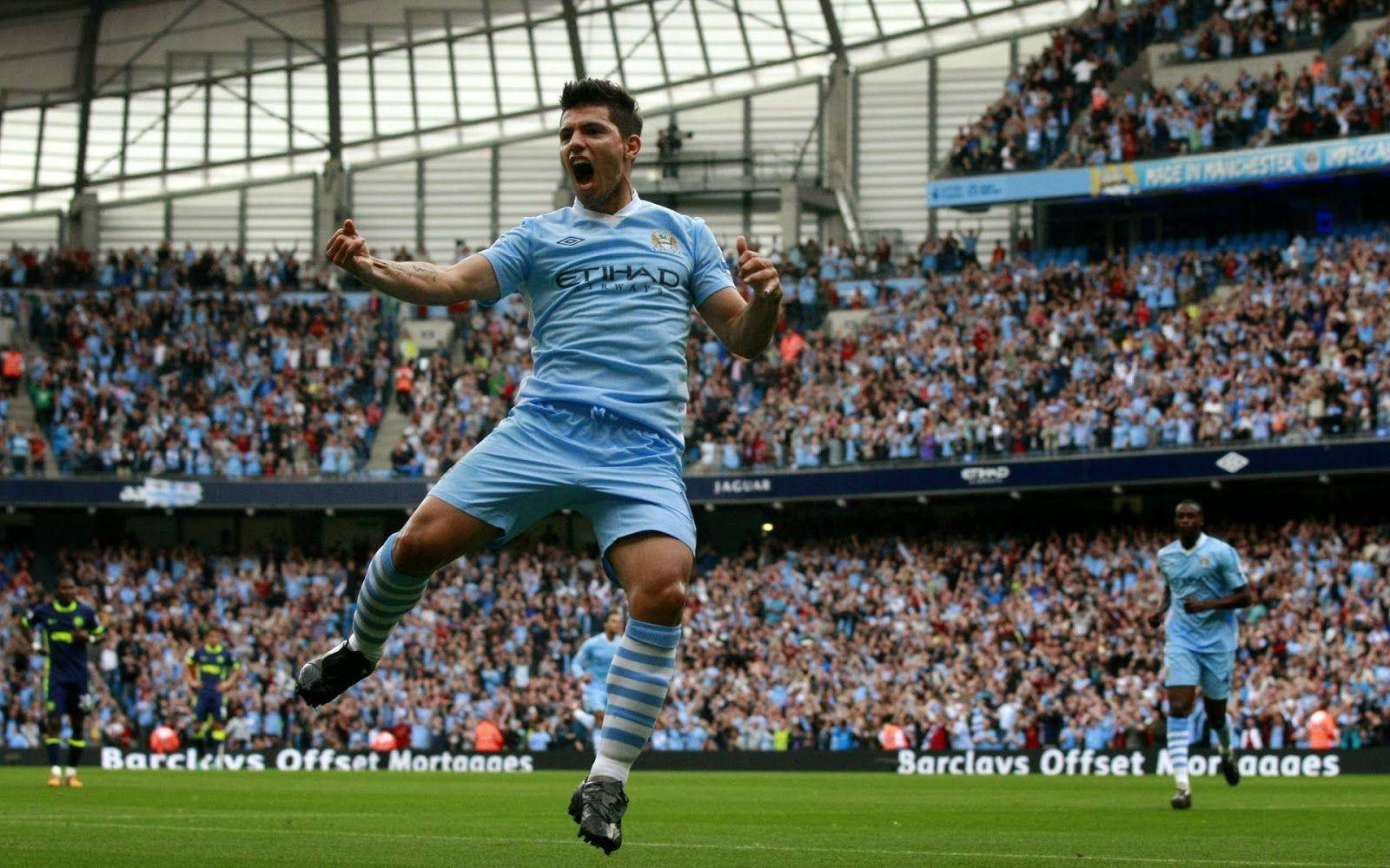 Manchester City Fc Player Cheering In Stadium Background