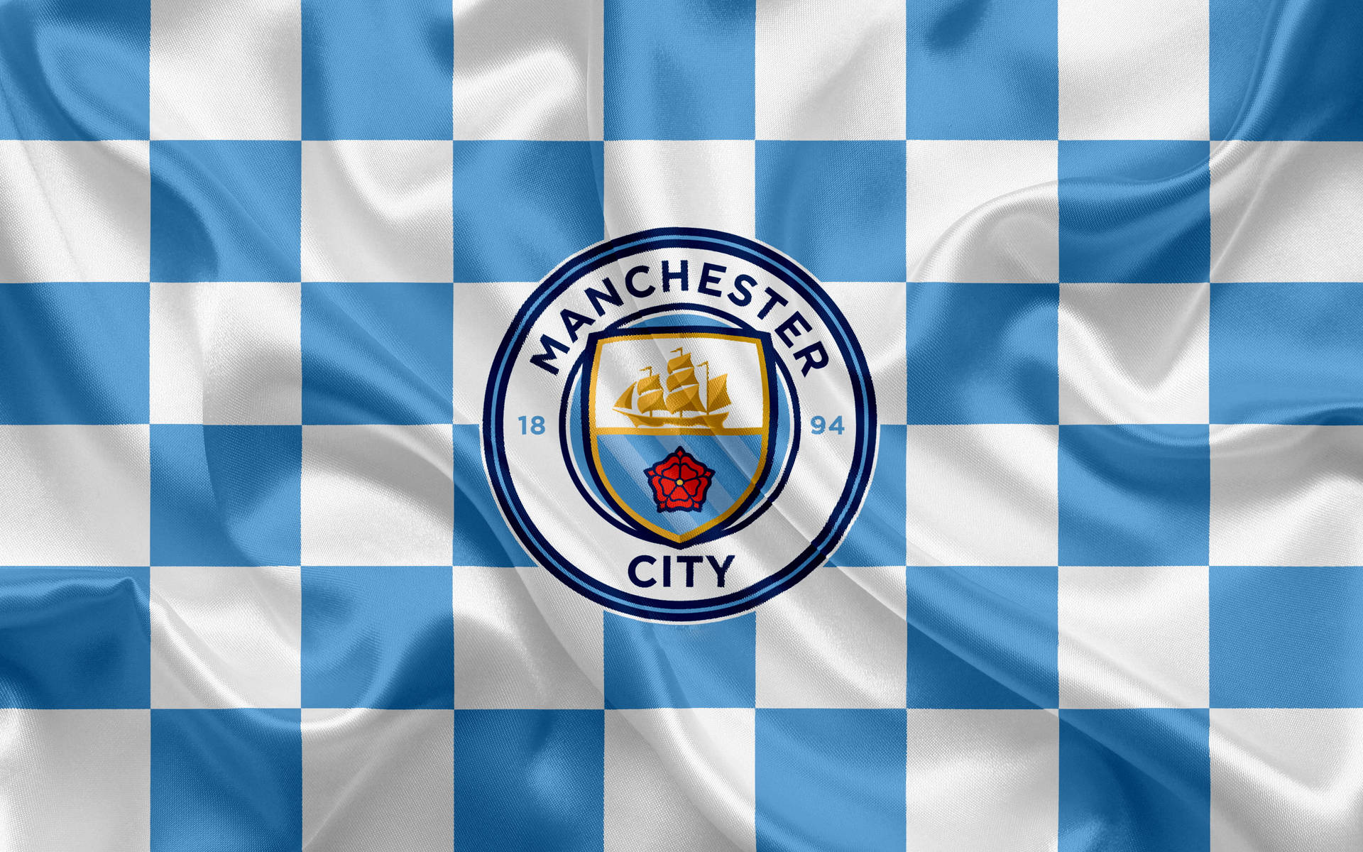 Manchester City Logo On Checkered Cloth Background