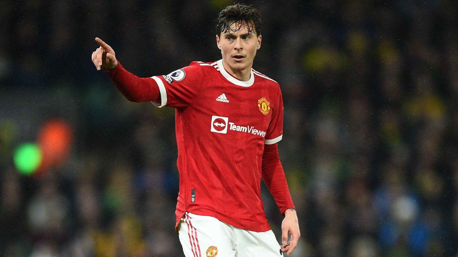 Manchester United Player Gesturing During Match Background