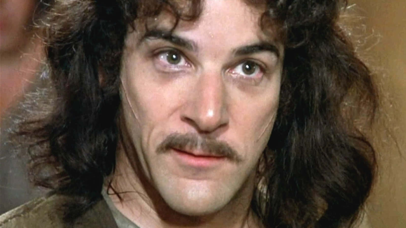 Mandy Patinkin Posing For A Photo Shoot Background