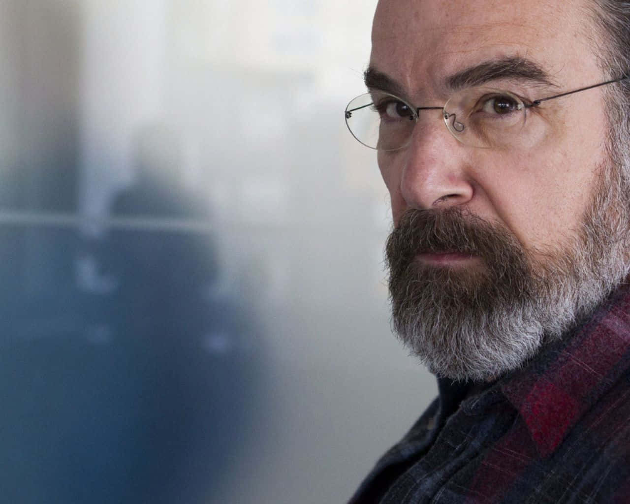 Mandy Patinkin Posing For A Photoshoot Background