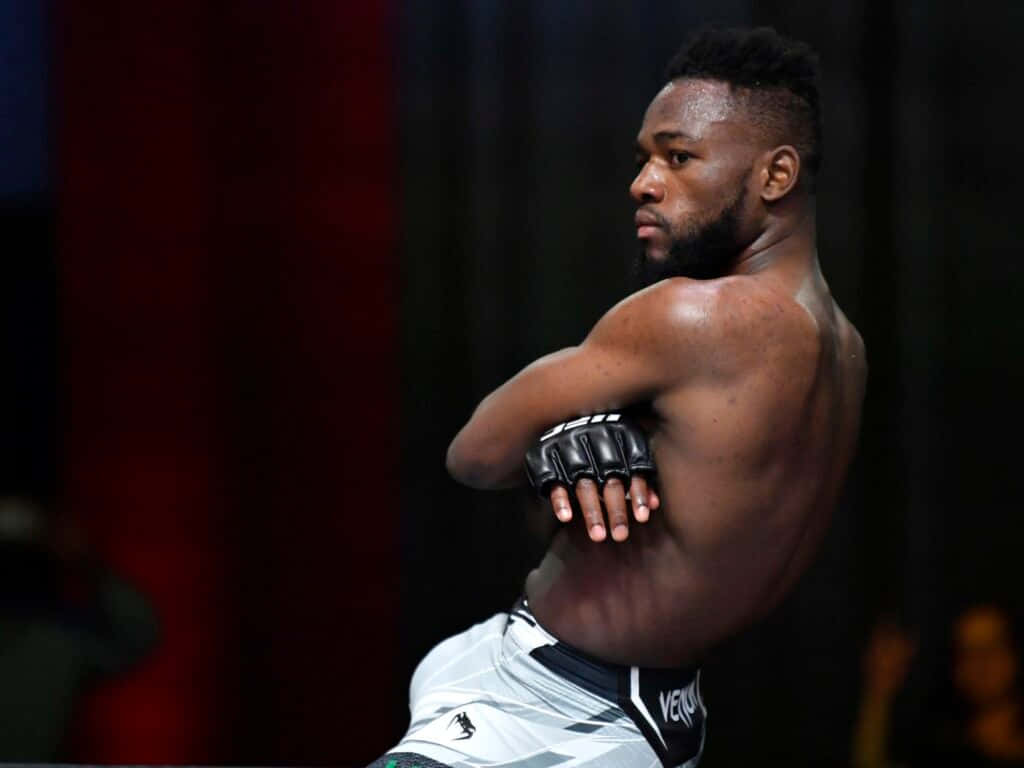 Manel Kape Arms Crossed