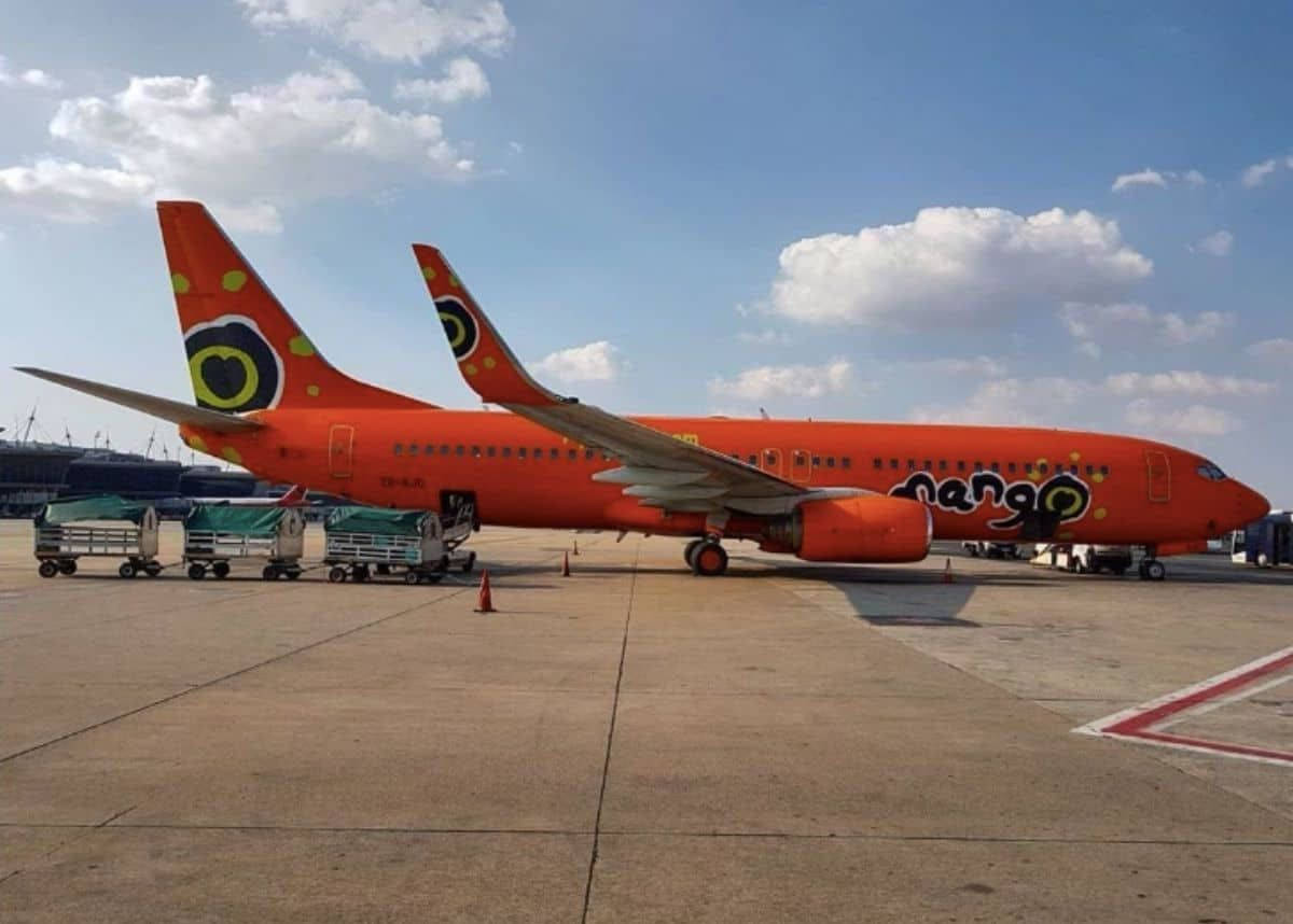 Mango Airlines Airplane With Baggage Carts Background