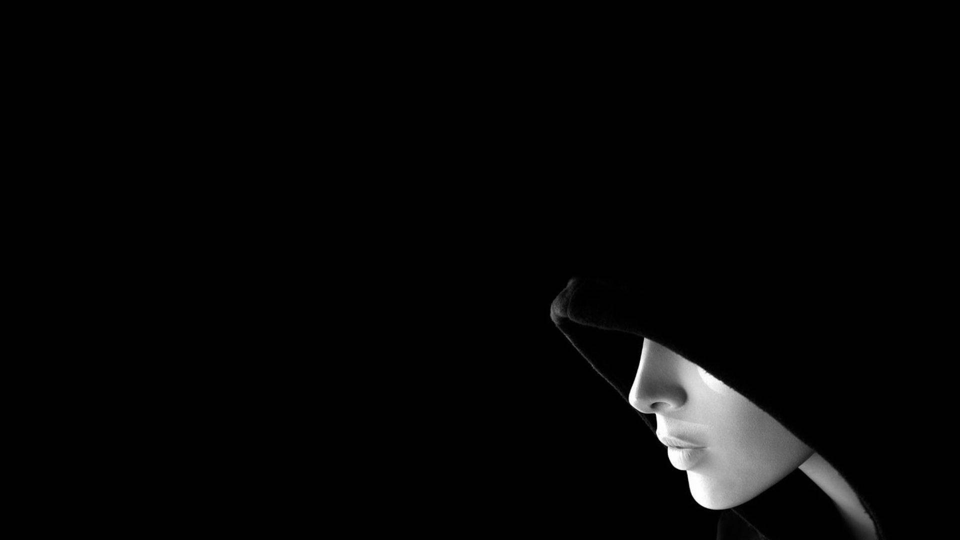 Mannequin In A Black Hood Background