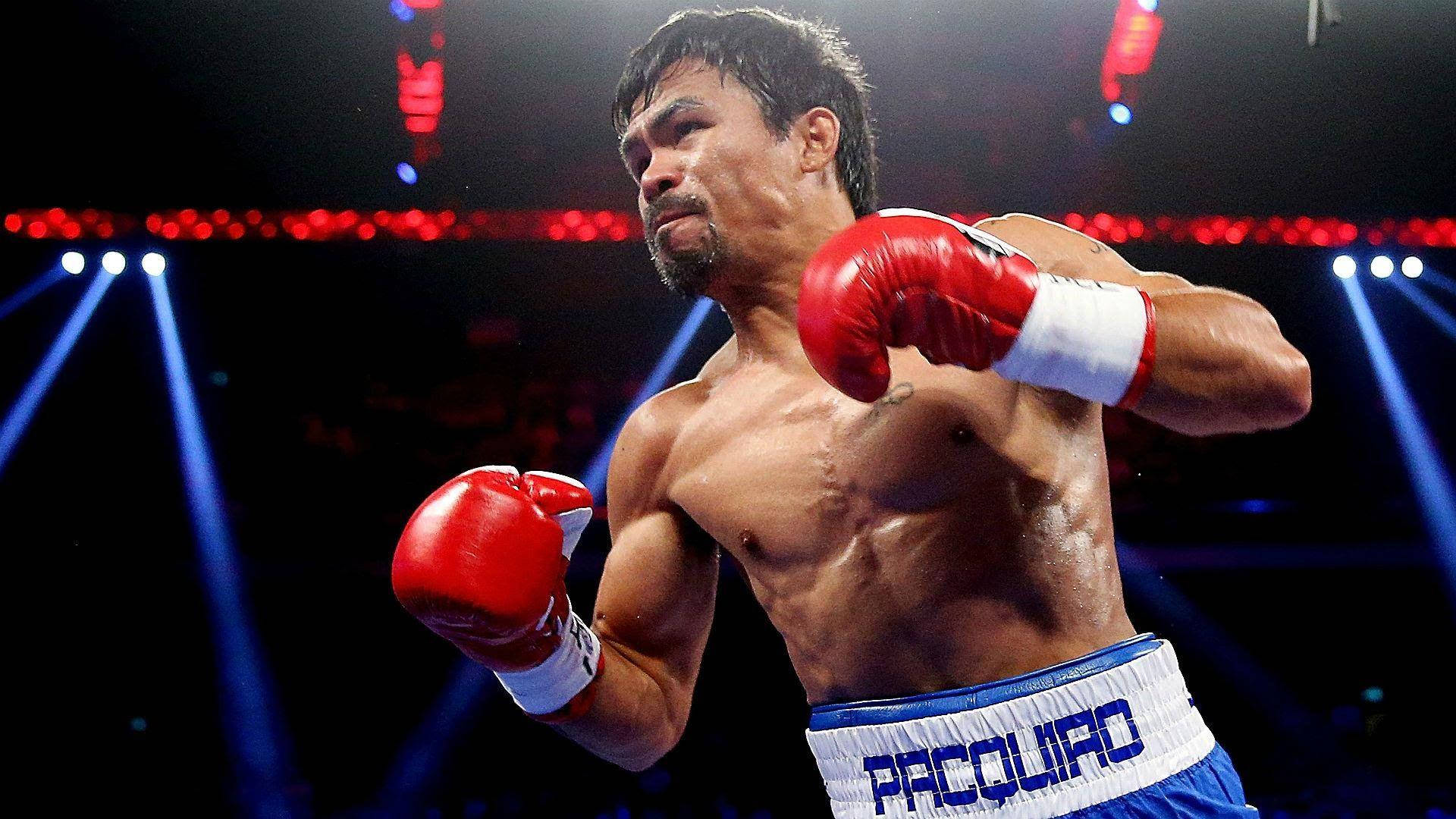 Manny Pacquiao Going For The Attack Background