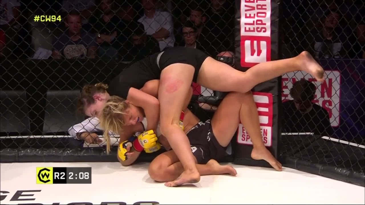 Manon Fiorot In Action During A Ufc Fight Background