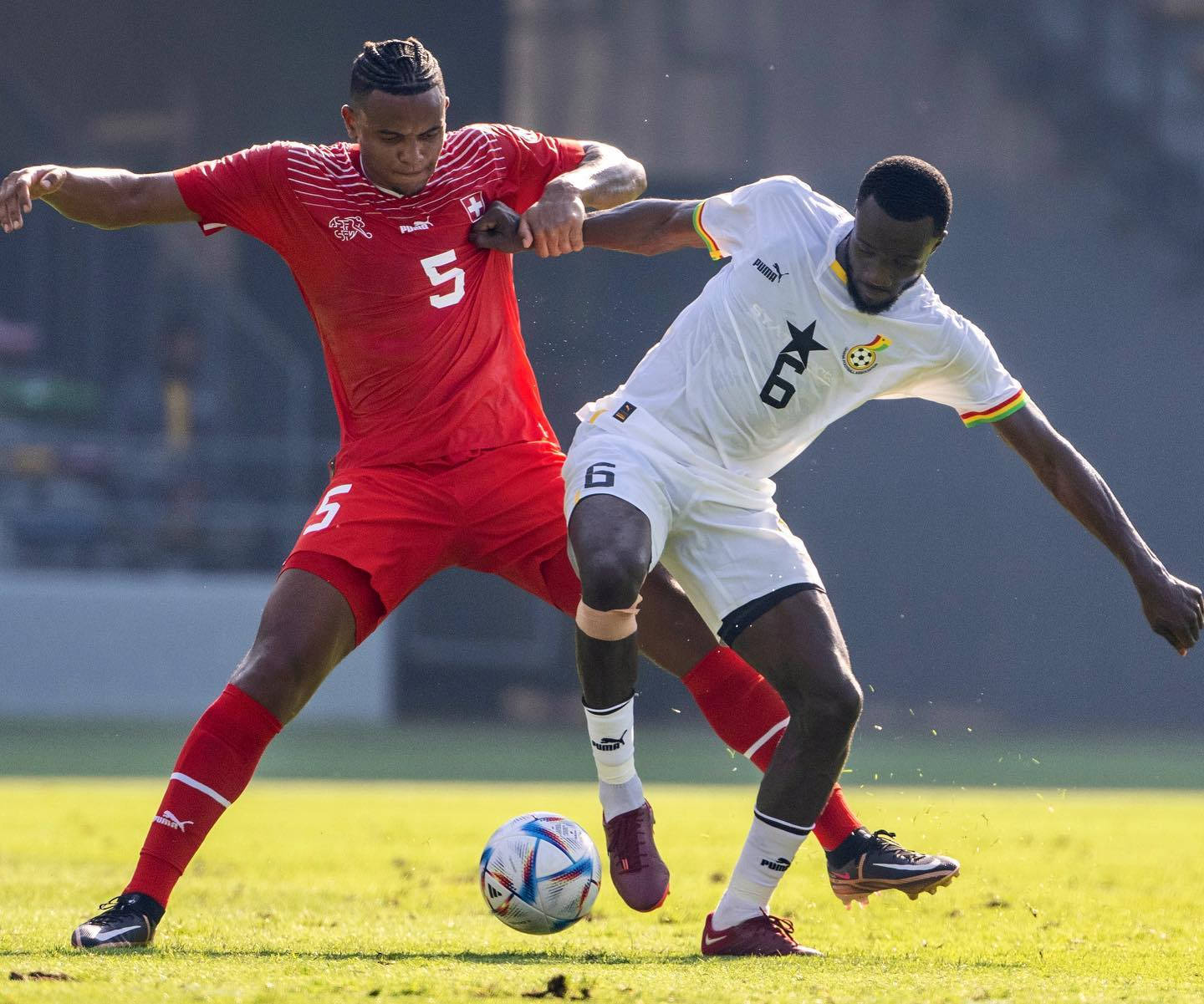 Manuel Akanji Fighting Over Ball Background