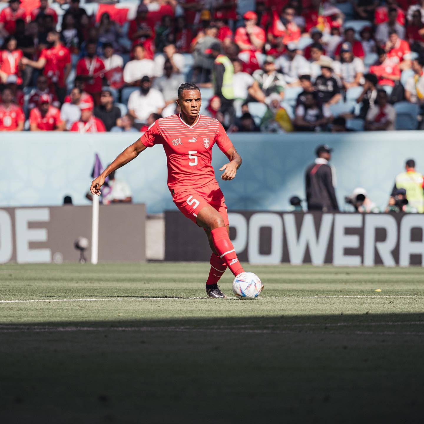 Manuel Akanji Running In All Red Background