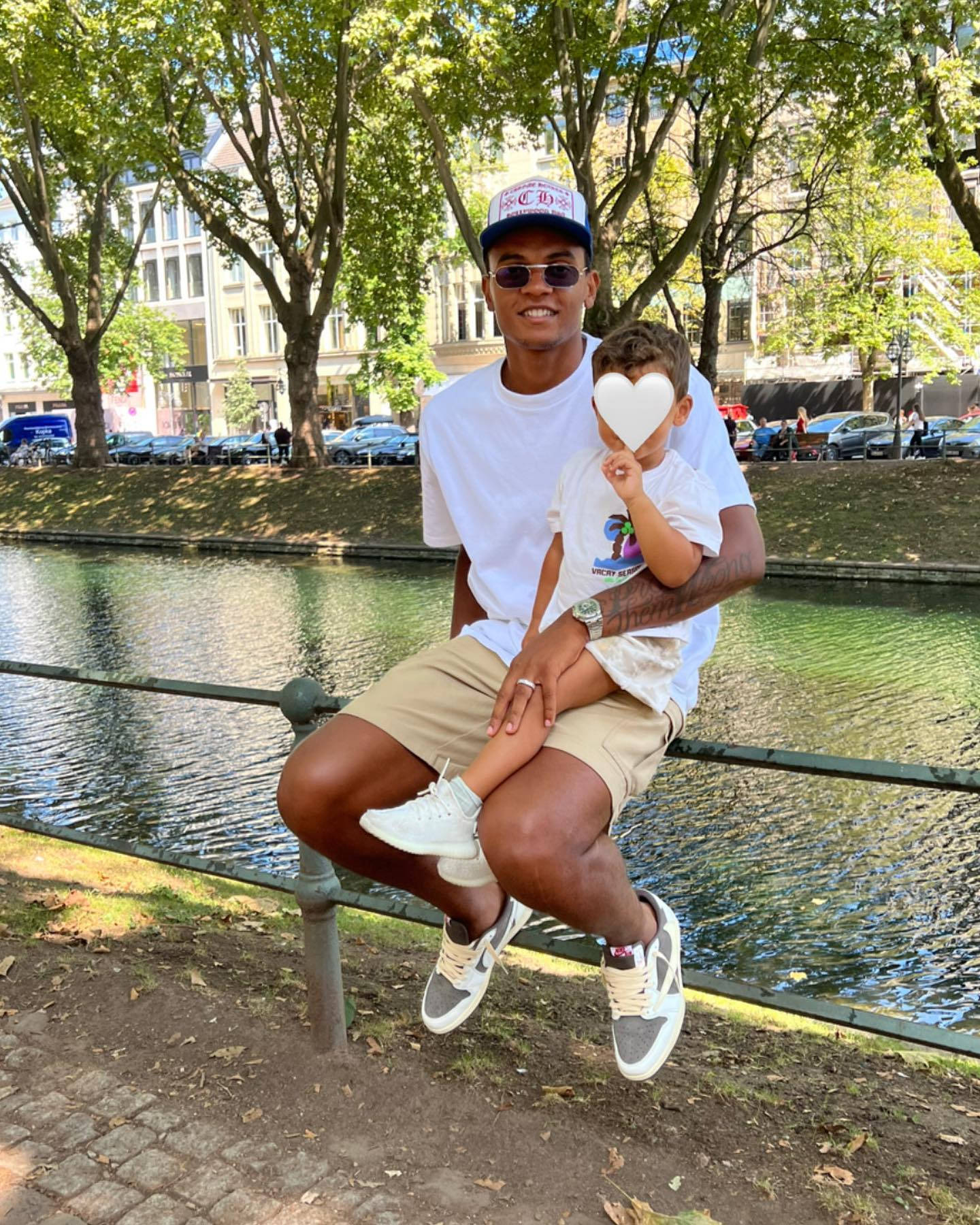 Manuel Akanji Sitting On The Railing Background