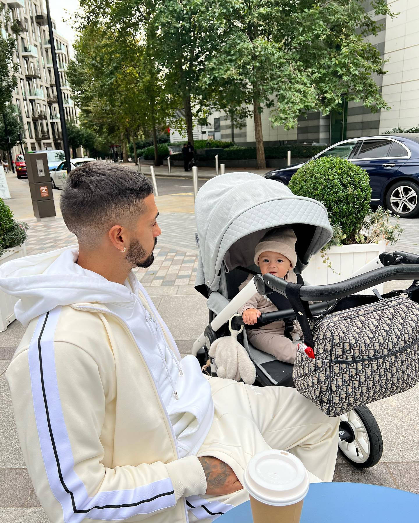 Manuel Lanzini And Baby In Stroller Background