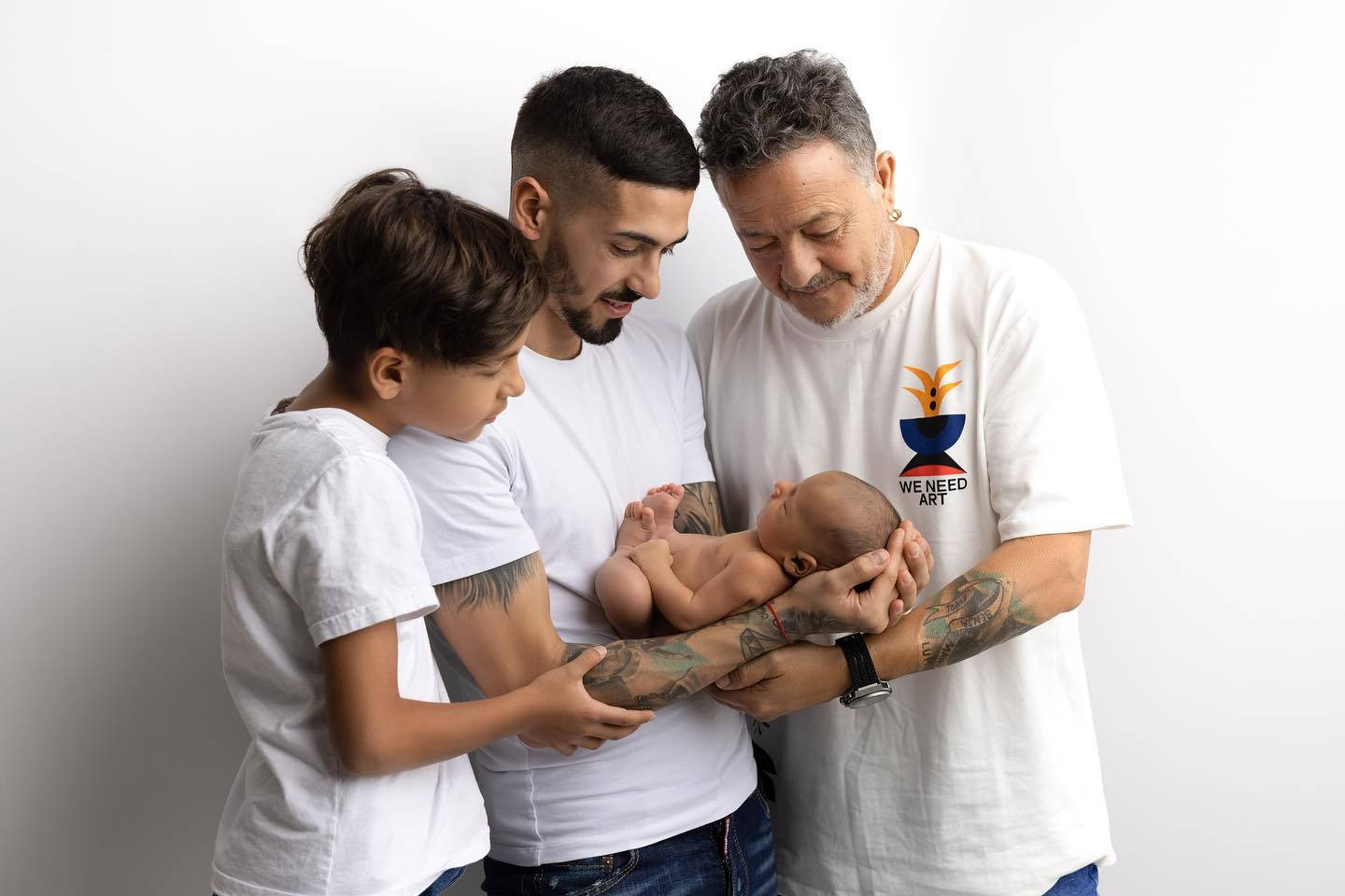 Manuel Lanzini Cradling A Baby Background