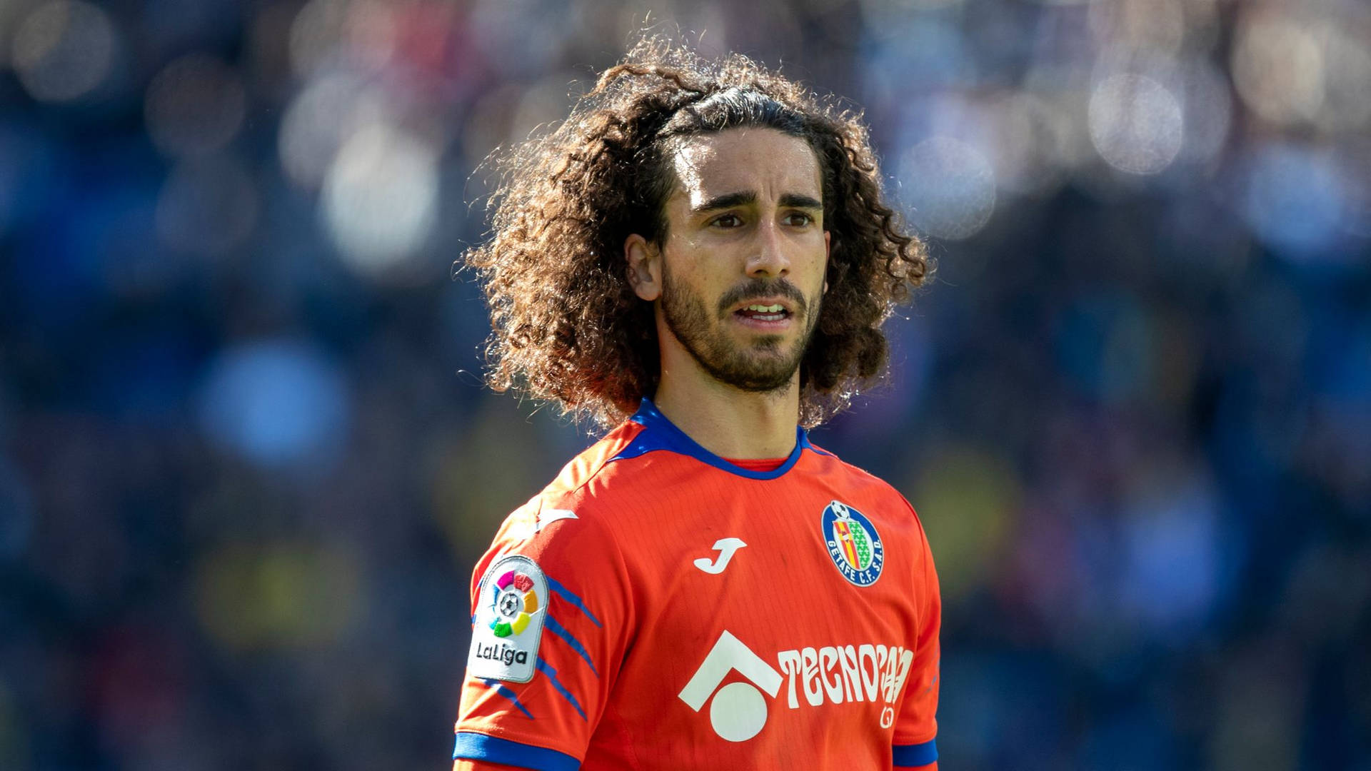 Marc Cucurella Immersed In Sunlight On The Field Background