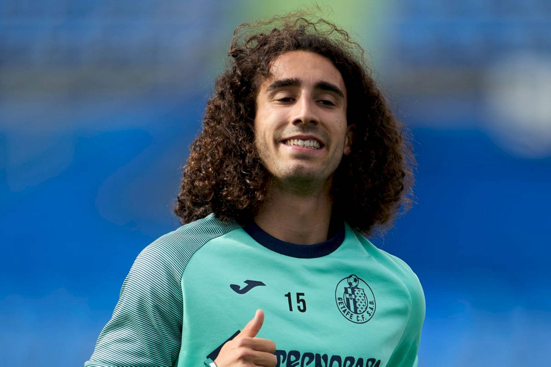 Marc Cucurella Teal Smirk Background