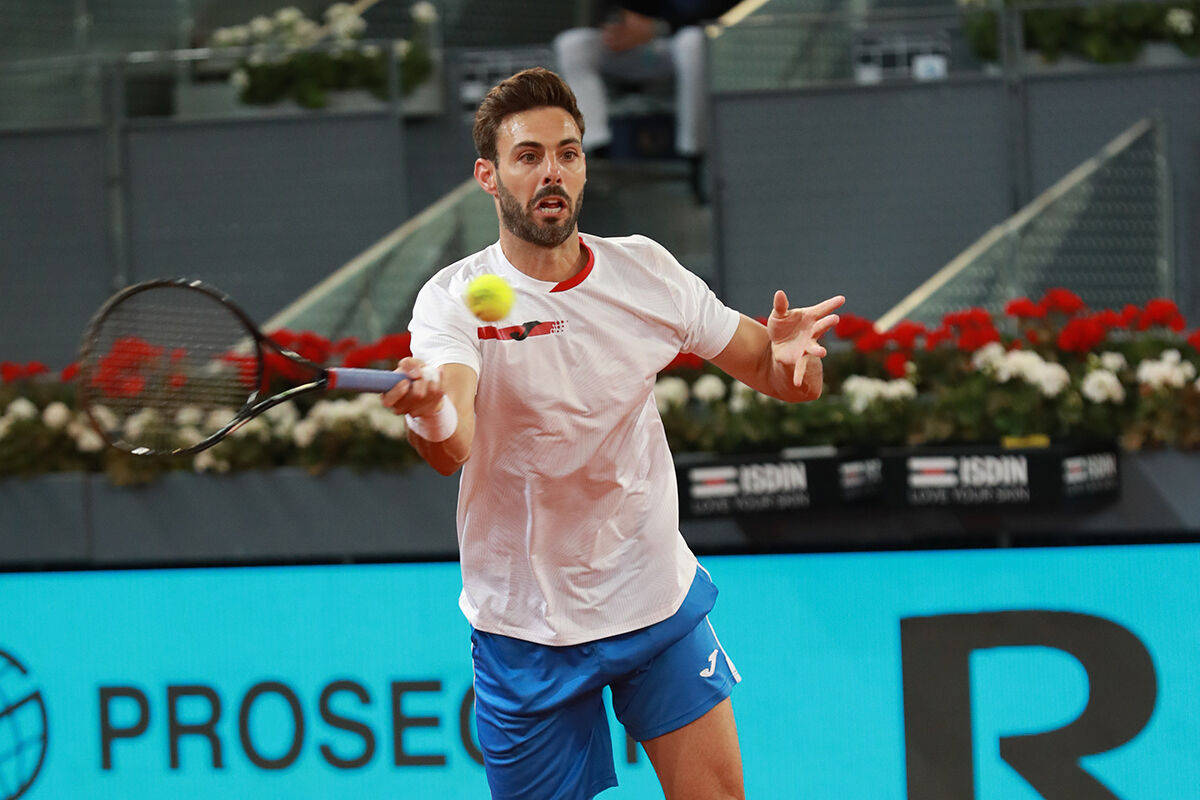 Marcel Granollers About To Hit Ball Background