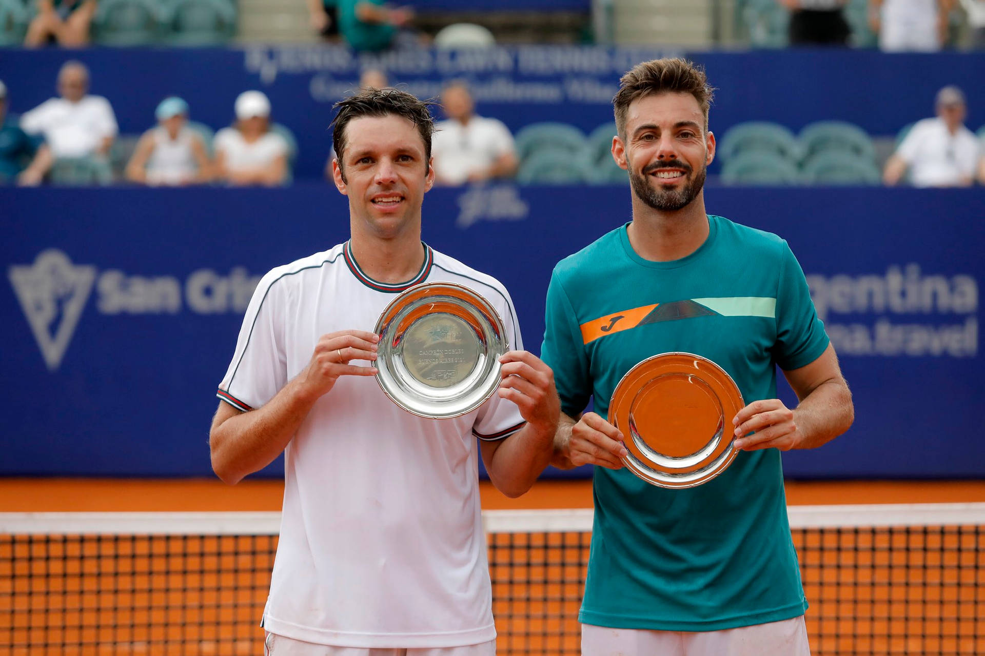 Marcel Granollers And Horacio Zeballos With Trophies Background